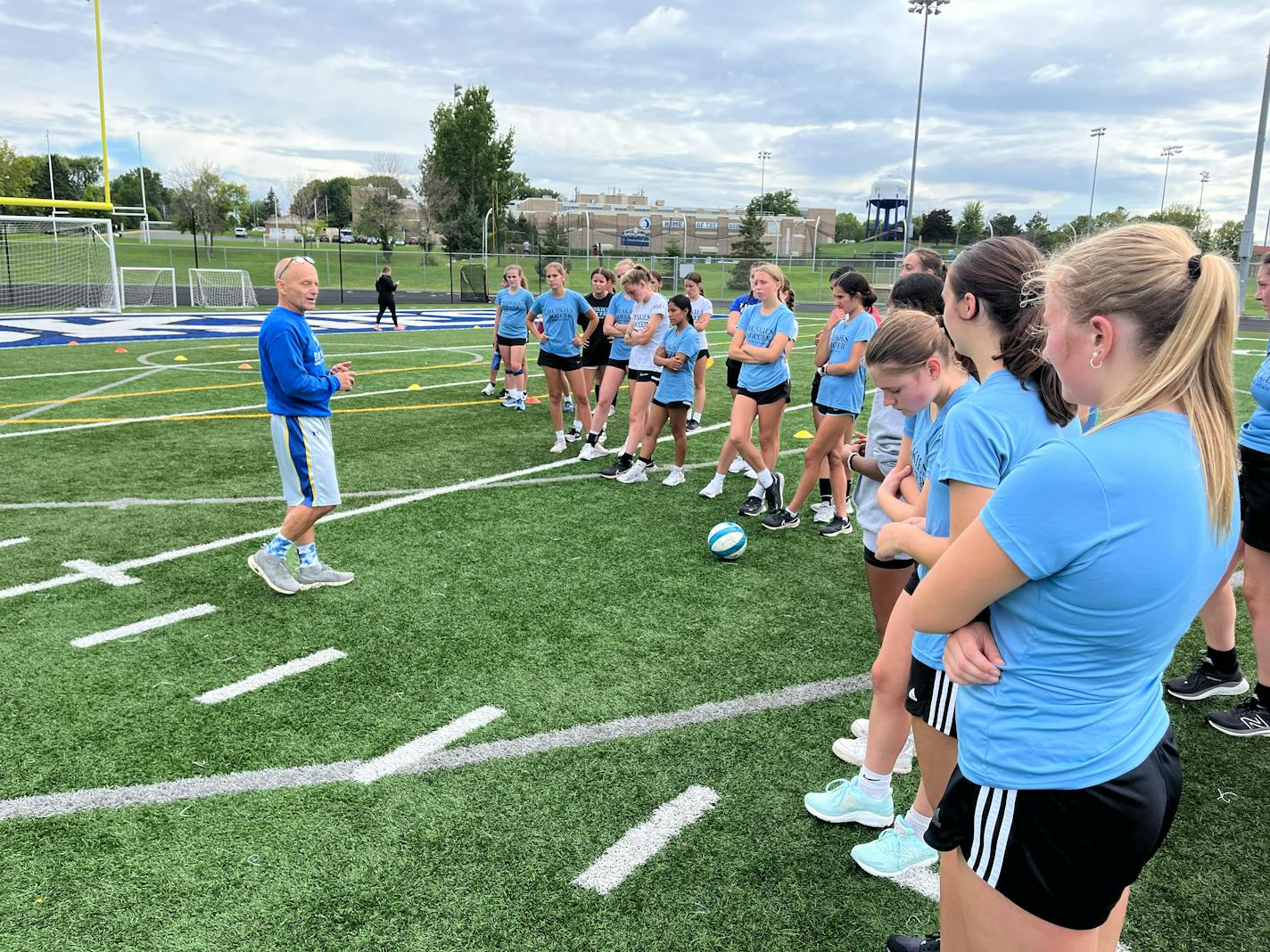 Co-head coach Paul Pawlyshyn addressed his St. Anthony Village High School girls soccer players — both varsity and junior varsity — in preparation for a skill dribbling drill at Dennison Field in Saint Anthony, Minnesota. Noah Furtado, Star Tribune