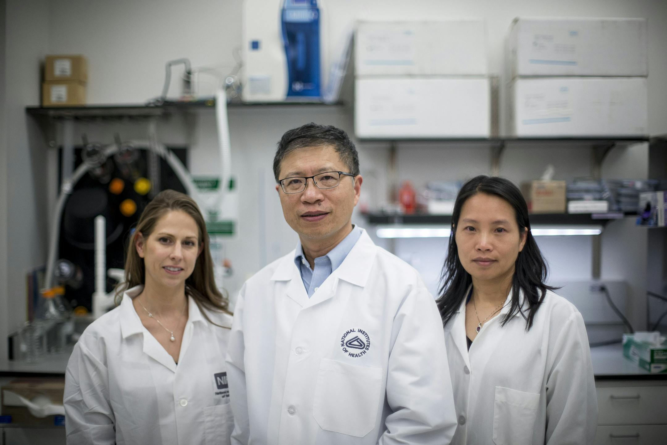 Wei Zheng, center, who runs a lab that is part of the Therapeutics for Rare and Neglected Diseases program, with Jennifer Kouznetsova, biologist and lab manager, left, and Miao Xu, scientist, in Bethesda, Md., April 6, 2016. A graduate student’s offhand remark has led to widespread research of the Zika virus that has provided findings about how the virus causes brain damage. (Gabriella Demczuk/The New York Times)