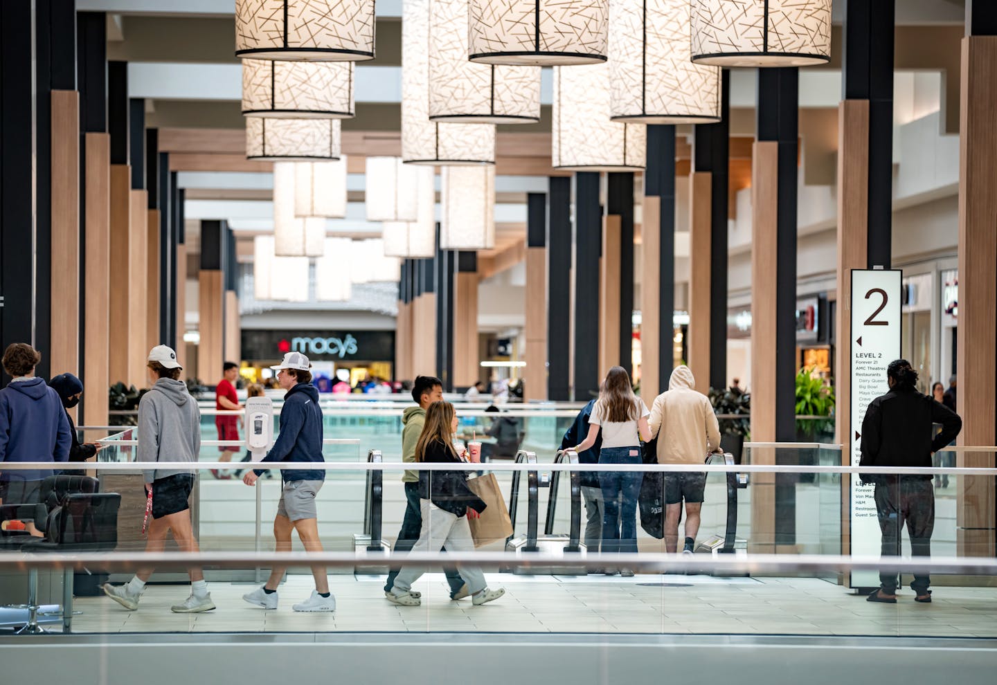 Shoppers at Roseville Center, Friday, April 29, 2022, Roseville, Minn. Malls are hosting events again, leasing space, and seeing store sales climb as consumers return to the mall to shop after two years of temporary closures and faltering traffic due to COVID-19.