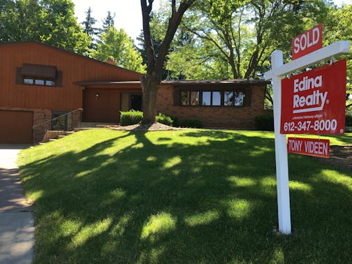 An Edina Realty sign outside of a home in June 2017. ORG XMIT: MIN1706151535355301