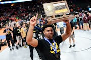 Apple Valley's Gable Steveson (shown celebrating with the Class 3A wrestling team championship trophy in March) won a gold medal at wrestling's junior