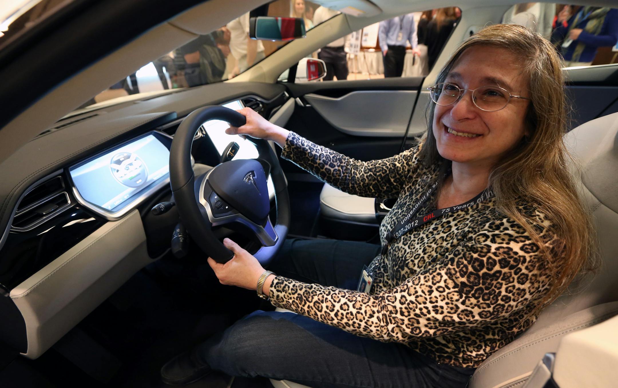 Elisa Collins, 3M software engineer sat in the Tesla S electric car as part of the 3M celebration of Earth Day with displays of other sustainable 3M products including Novec Enginered Fluids, LED lighting and 3M window films, on 4/22/14 at 3M headquarters in Maplewood. 3M also received an award from the EPA for its work in energy efficiency.] Bruce Bisping/Star Tribune bbisping@startribune.com Elisa Collins/source.