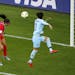 United States' Alex Morgan, left, heads the ball past Thailand's Natthakarn Chinwong to score her team's first goal during the Women's World Cup Group
