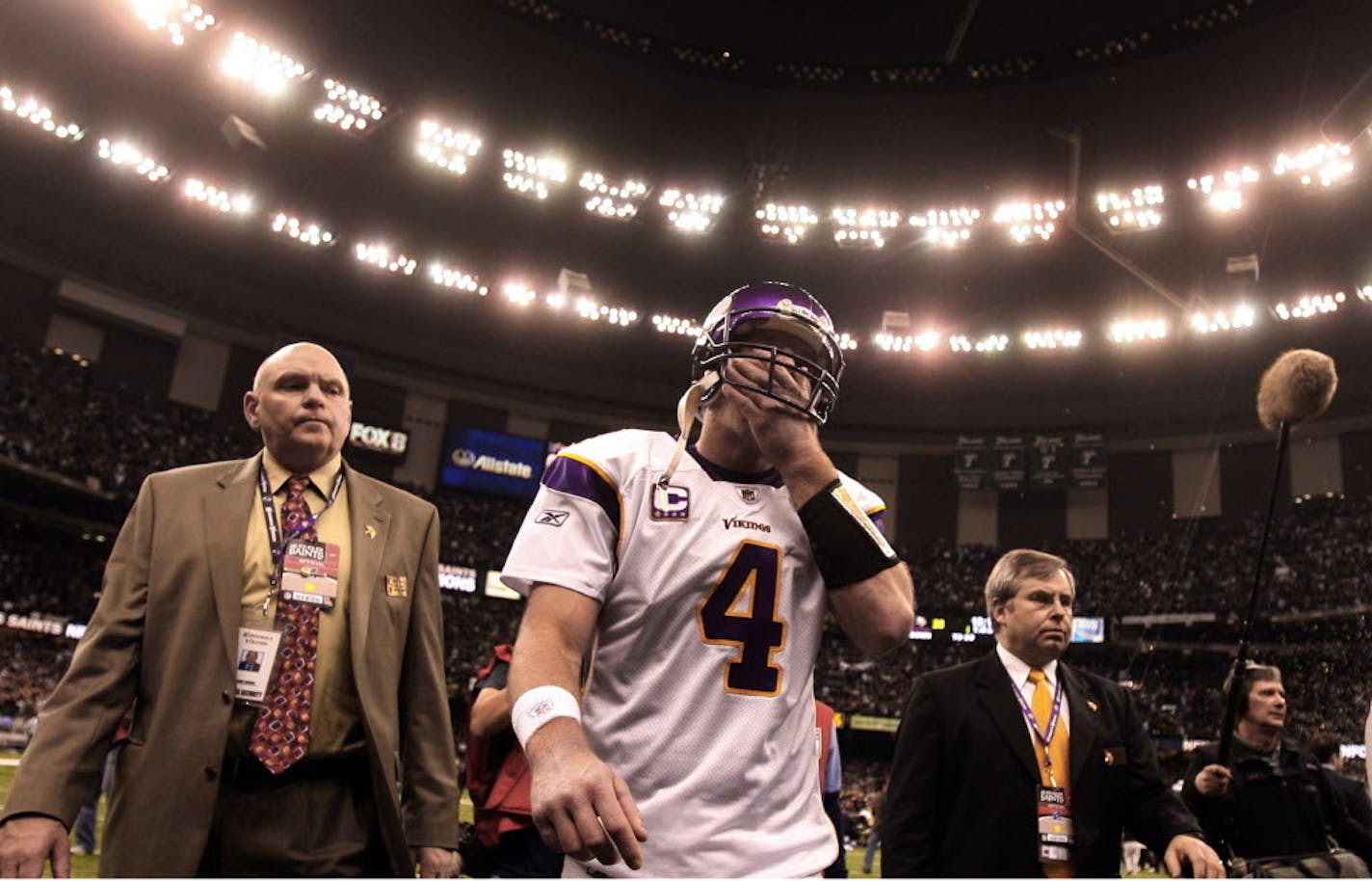 Brett Favre, injured and battered, walked off the field.