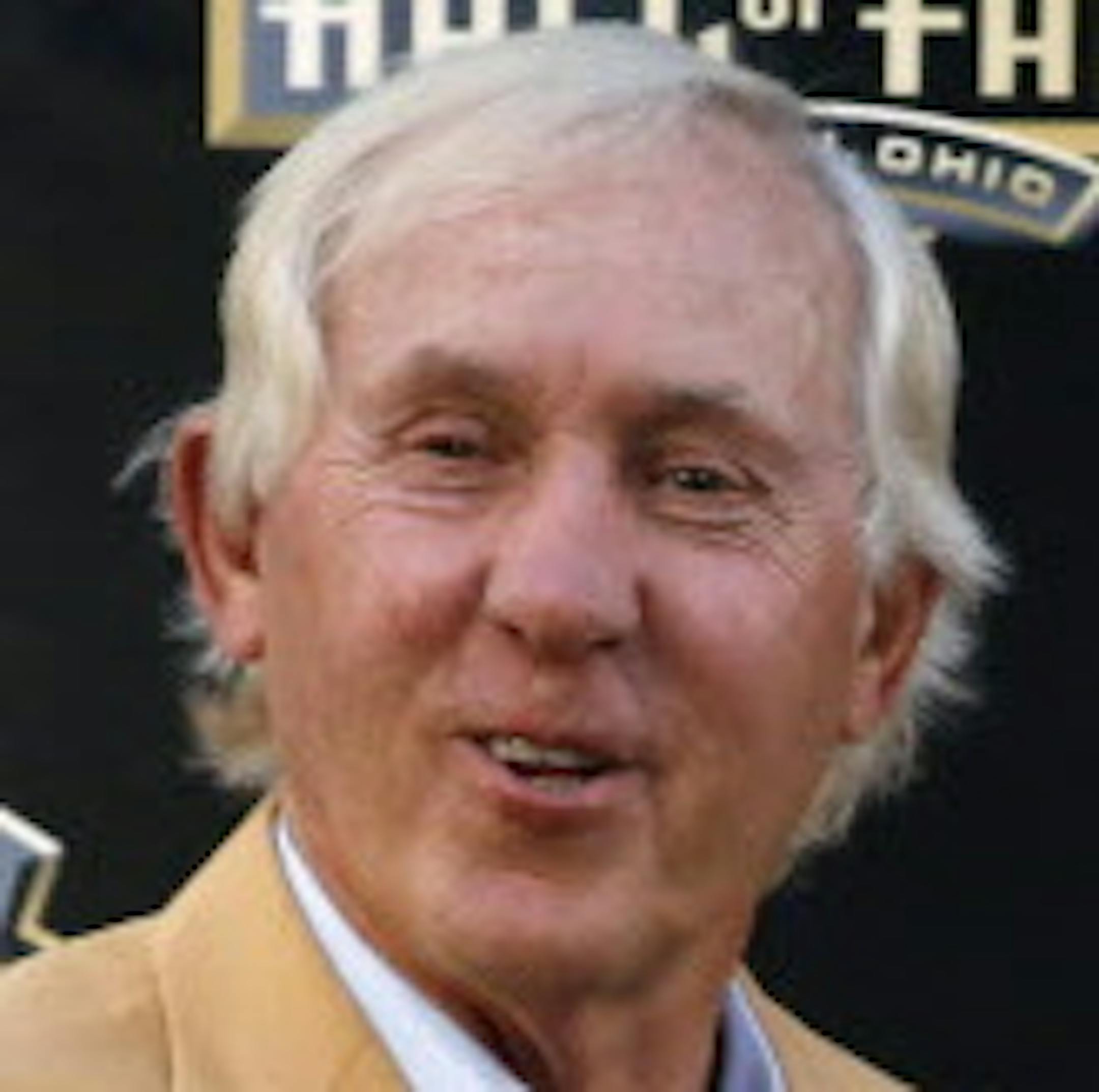 Former NFL player Mick Tinglehoff, right, poses with his bust and his presenter, Hall of Fame quarterback Fran Tarkenton, during inductions at the Pro Football Hall of Fame, Saturday, Aug. 8, 2015, in Canton, Ohio. (AP Photo/Gene J. Puskar) ORG XMIT: MIN2015080820312162