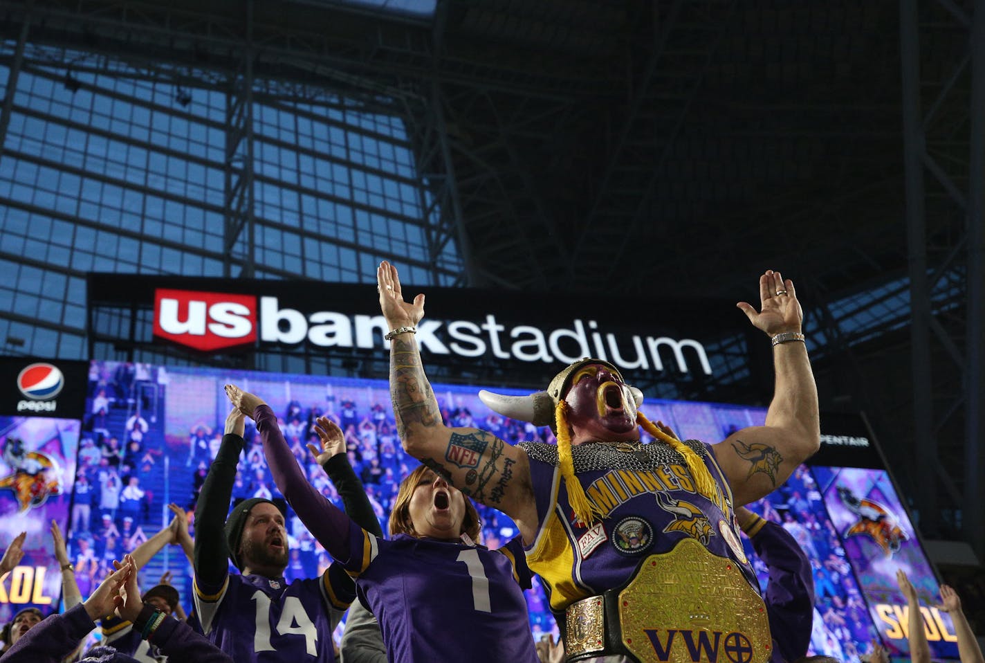 Minnesota Vikings fans, including Syd Davy, foreground, who dressed the part, erupt into an improvised "Skol!" chant as they leave U.S. Bank Stadium after the Vikings had just completed an improbable 29-25 victory over the New Orleans Saints in the NFC divisional playoff game on Sunday.