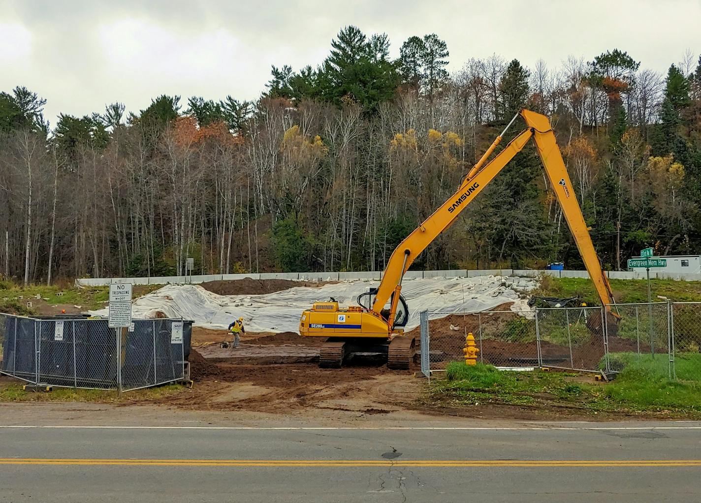 Restoration of a disturbed burial ground continued Thursday along Evergreen Memorial Highway on the western edge of Duluth.