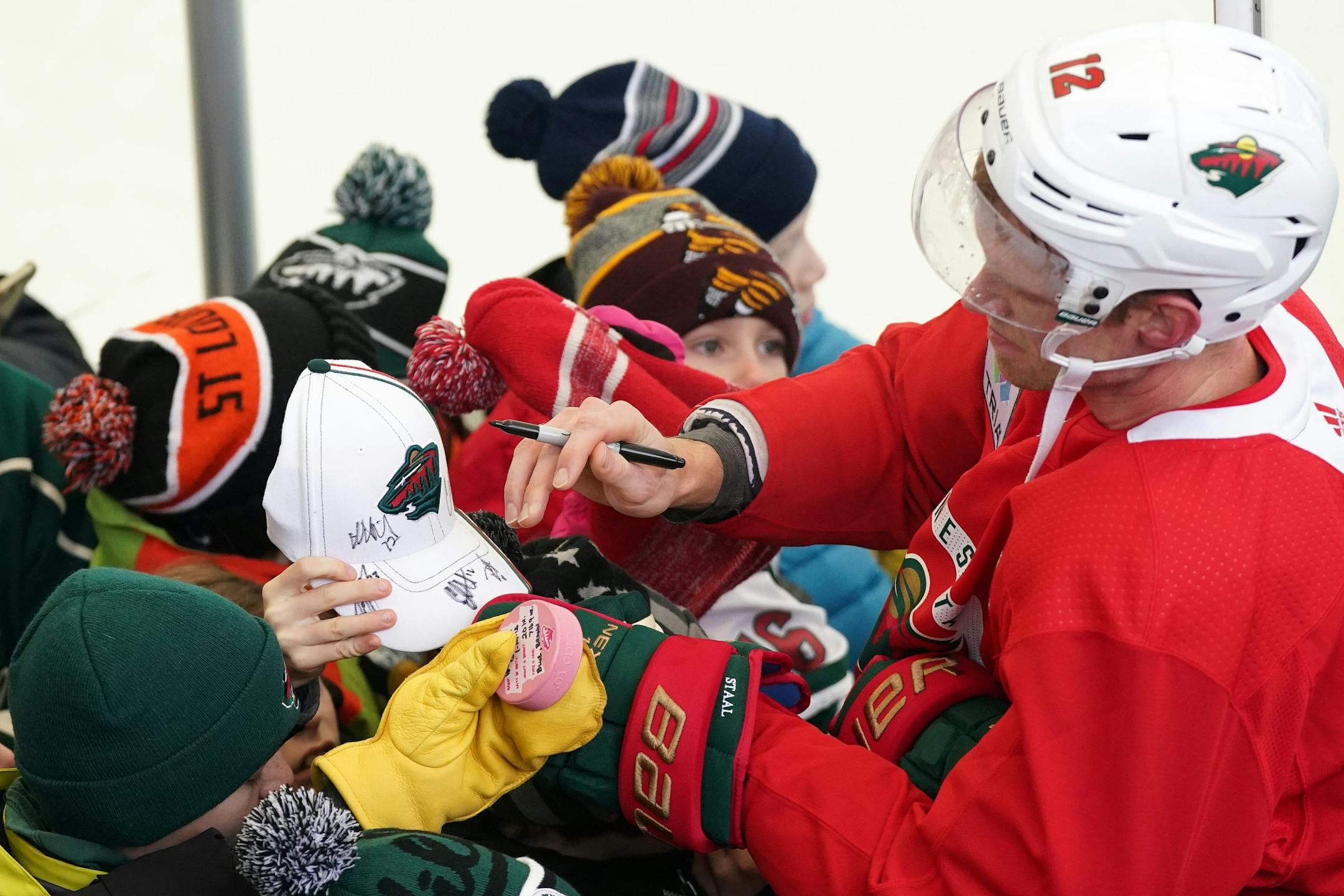 Minnesota Wild center Eric Staal (12) signed autographs following the Wild's outdoor practice Thursday.