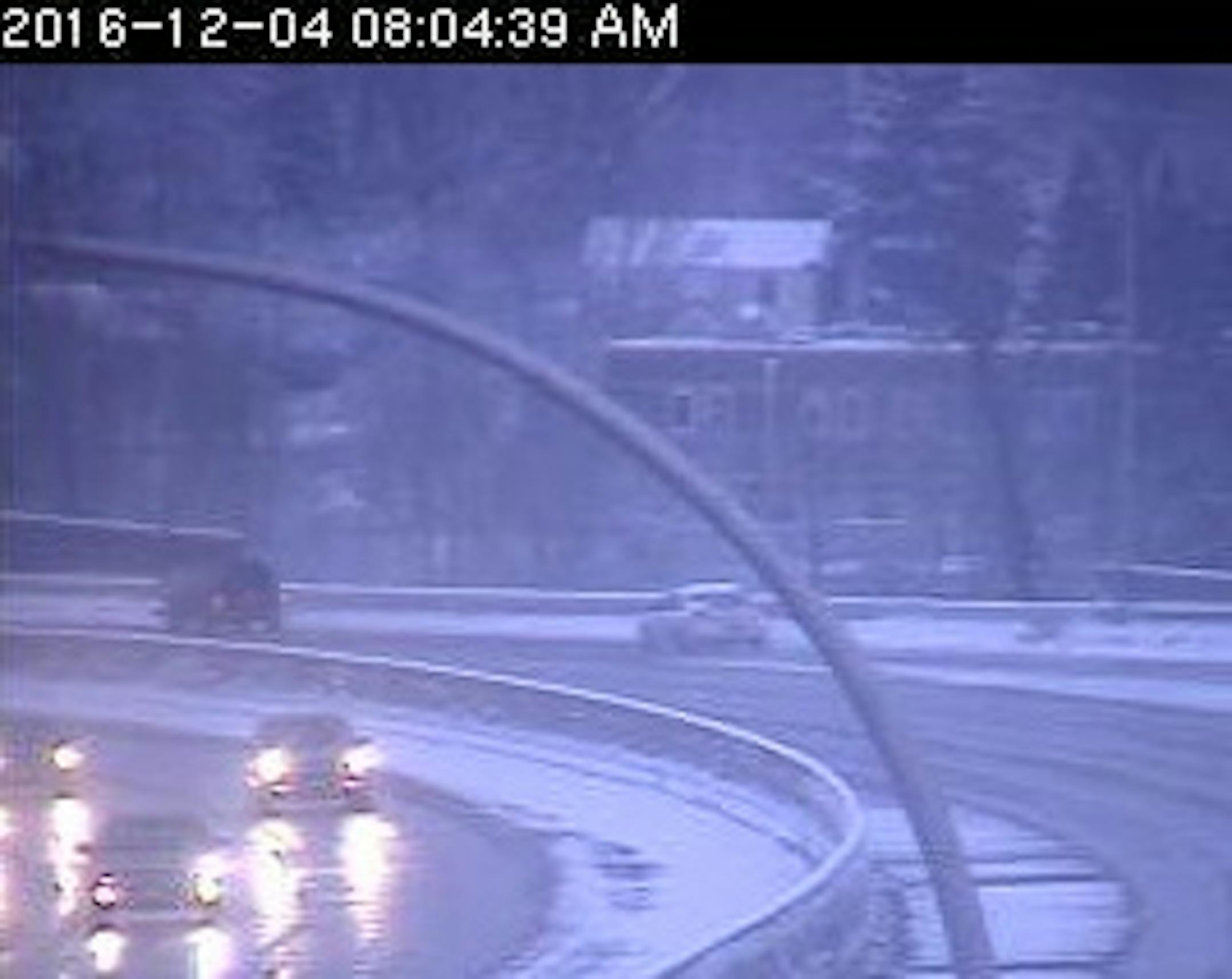 Hwy. 100 in the west metro was one of many slickened by a predawn snow Sunday.