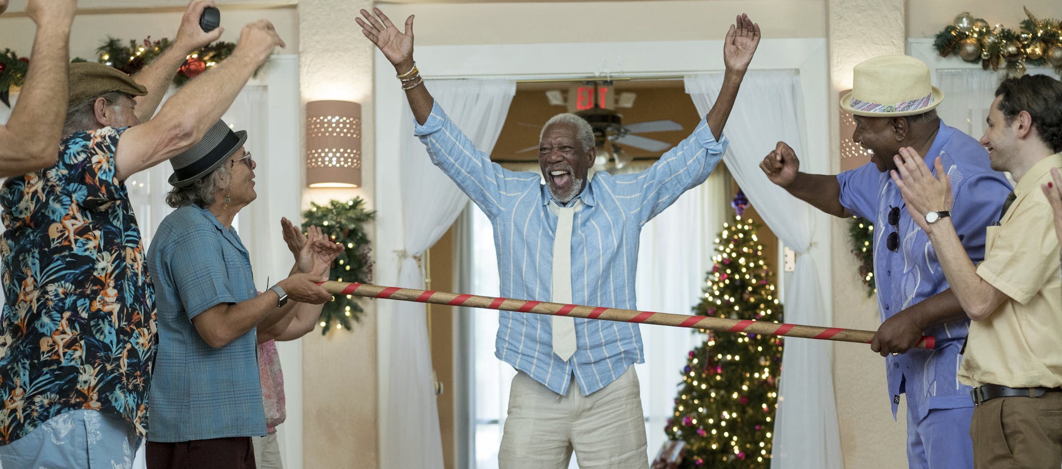 This image released by Broad Green Pictures shows Morgan Freeman, center, in a scene from "Just Getting Started." (Lewis Jacobs/Broad Green Pictures via AP)