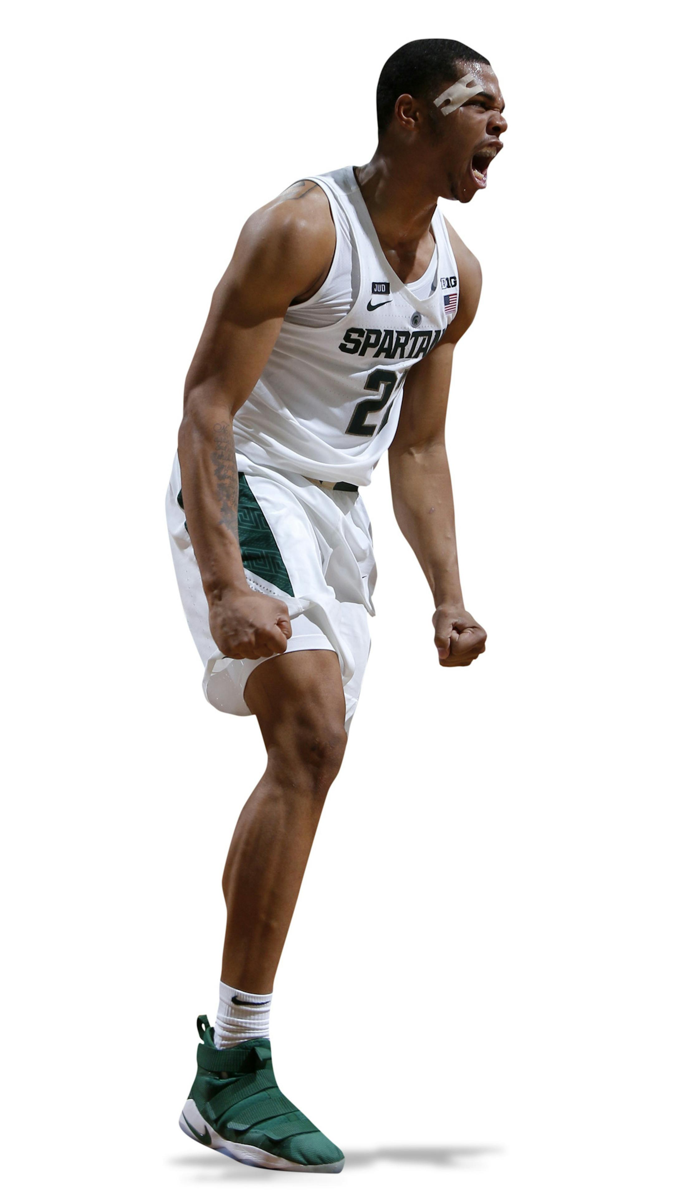 Michigan State's Miles Bridges, center, and Jaren Jackson Jr. (2) celebrate after Bridges dunked against Ferris State during the second half of an NCAA college basketball exhibition game, Thursday, Oct. 26, 2017, in East Lansing, Mich. (AP Photo/Al Goldis) ORG XMIT: ELJ109