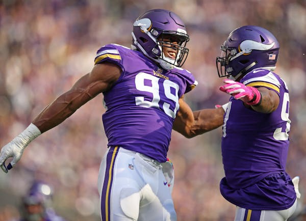 Minnesota Vikings defensive end Danielle Hunter (99) left celebrated with Everson Griffen (97) on his forth quarter sack at U.S Bank Stadium Sunday Oc