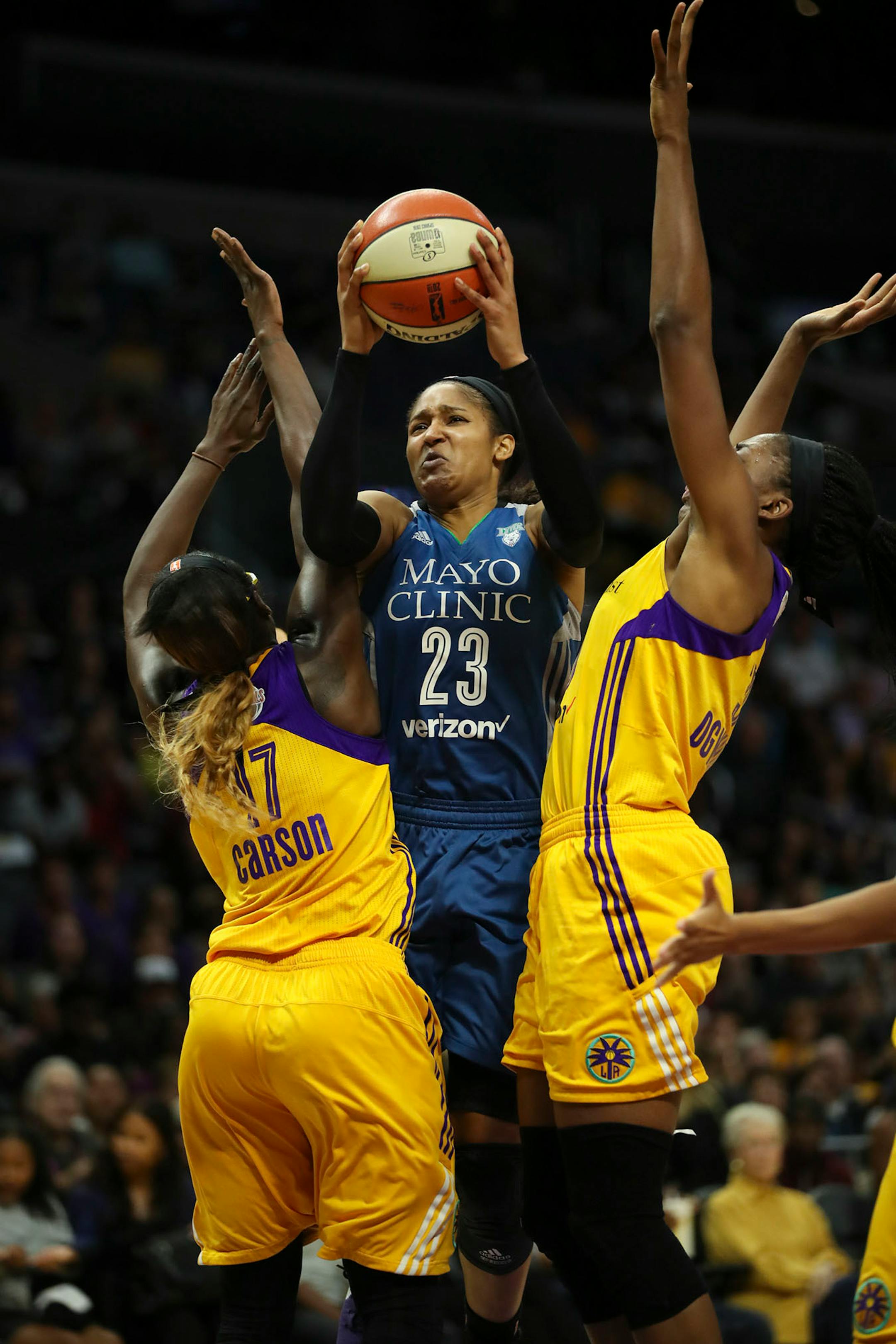 Minnesota Lynx forward Maya Moore (23) was fouled by Los Angeles Sparks forward Essence Carson (17) while shooting in the second quarter.
