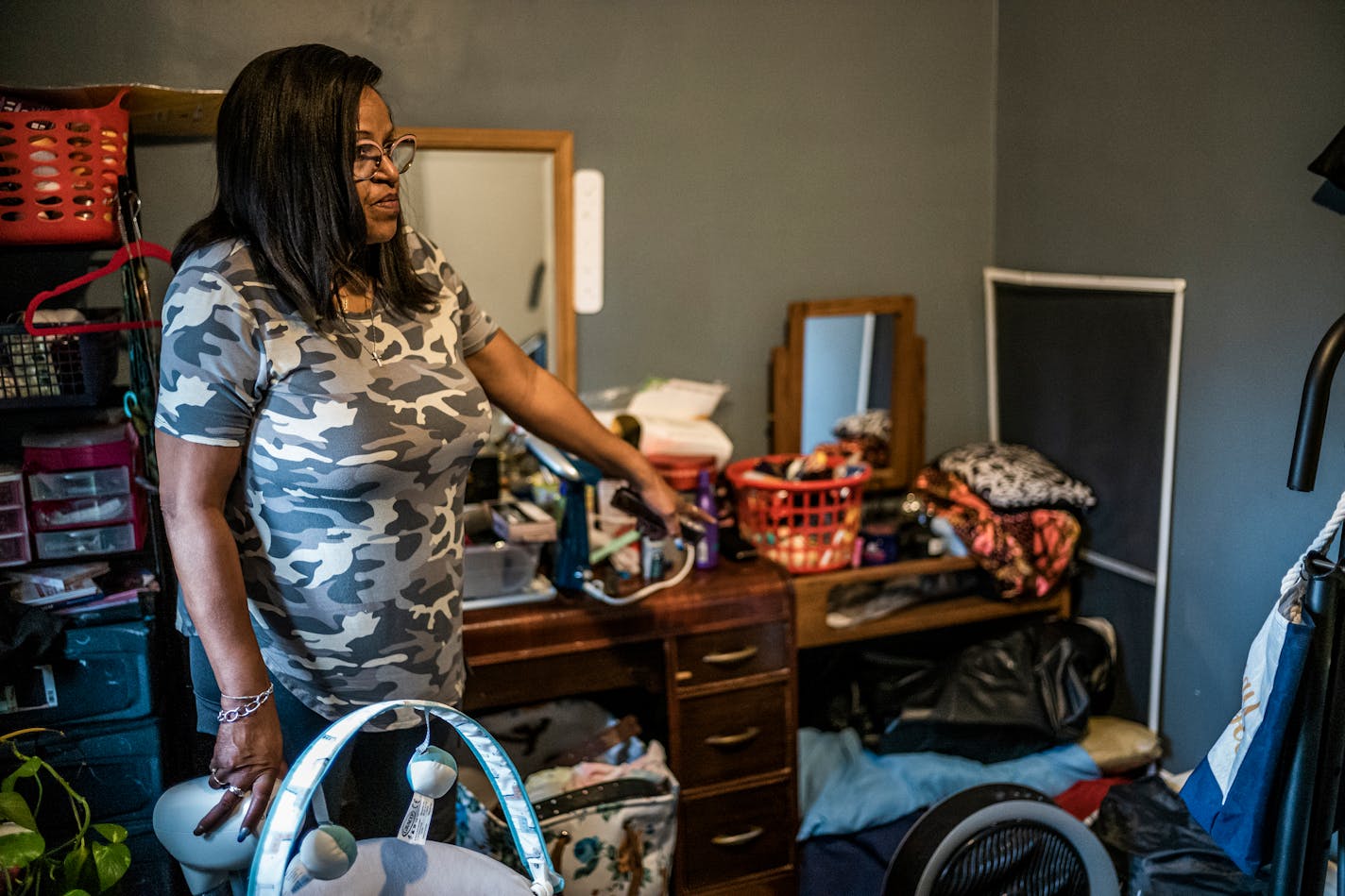 Tina Thomas, grandmother of a teenager who allegedly violently assaulted an Uber driver in St. Paul, points to where he sometimes sleeps in her home in St. Paul on Oct. 12, 2021. Like many other troubled youth in St. Paul, the teenager avoided criminal charges and has been sent to community programming. But Thomas, his primary caregiver, says that he's dangerous and out of control. ]RICHARD TSONG-TAATARII • richard.tsong-taatarii@startribune.com