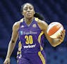 Los Angeles Sparks forward Nneka Ogwumike brings the ball up court against the Chicago Sky during the first half of Game 4 of the WNBA basketball semi