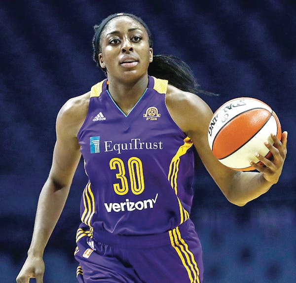 Los Angeles Sparks forward Nneka Ogwumike brings the ball up court against the Chicago Sky during the first half of Game 4 of the WNBA basketball semi
