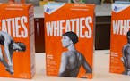 New Wheaties boxes feature Olympic gold medalists Greg Louganis, Janet Evans and Edwin Moses.