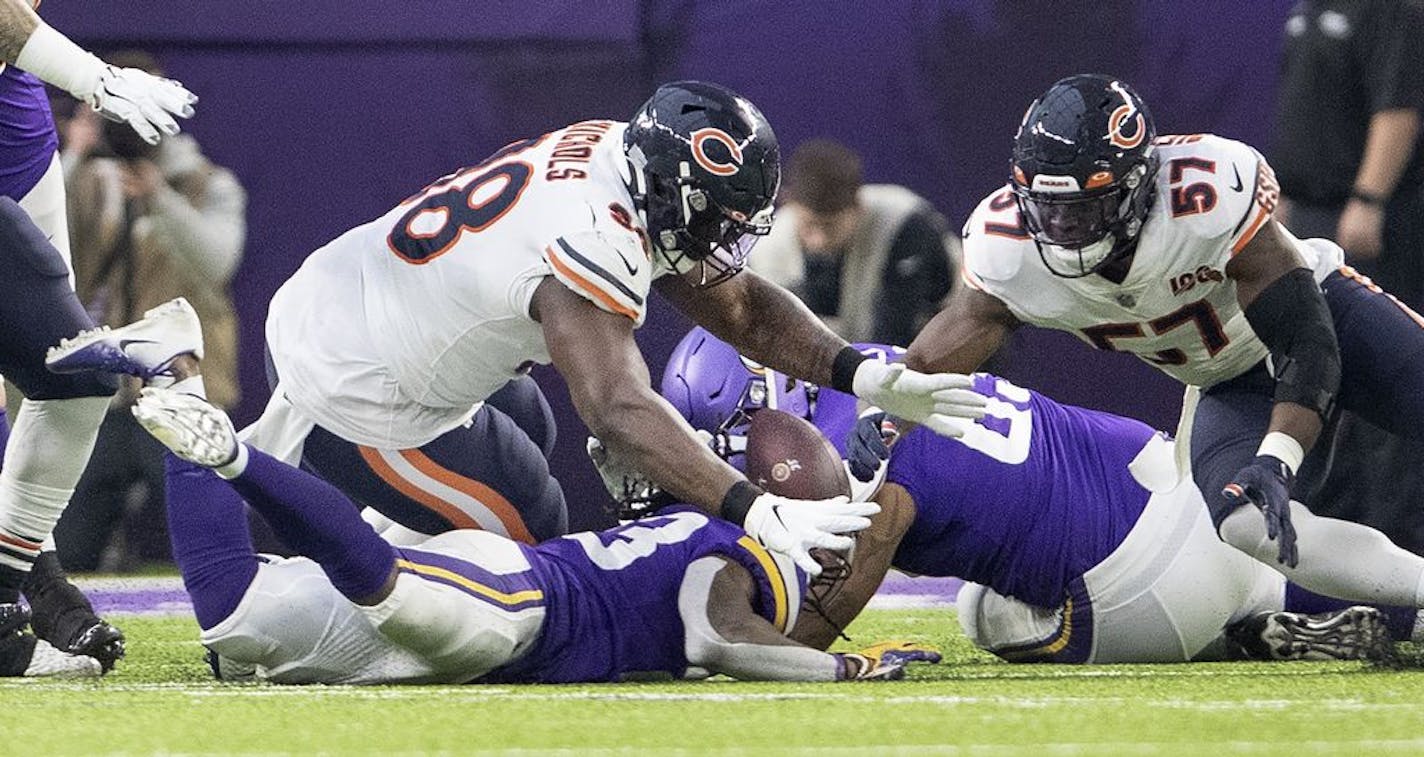 Minnesota Vikings running back Mike Boone (23) fumbled the ball in the first quarter. It was recovered by Chicago Bears' Bilal Nichols (98).