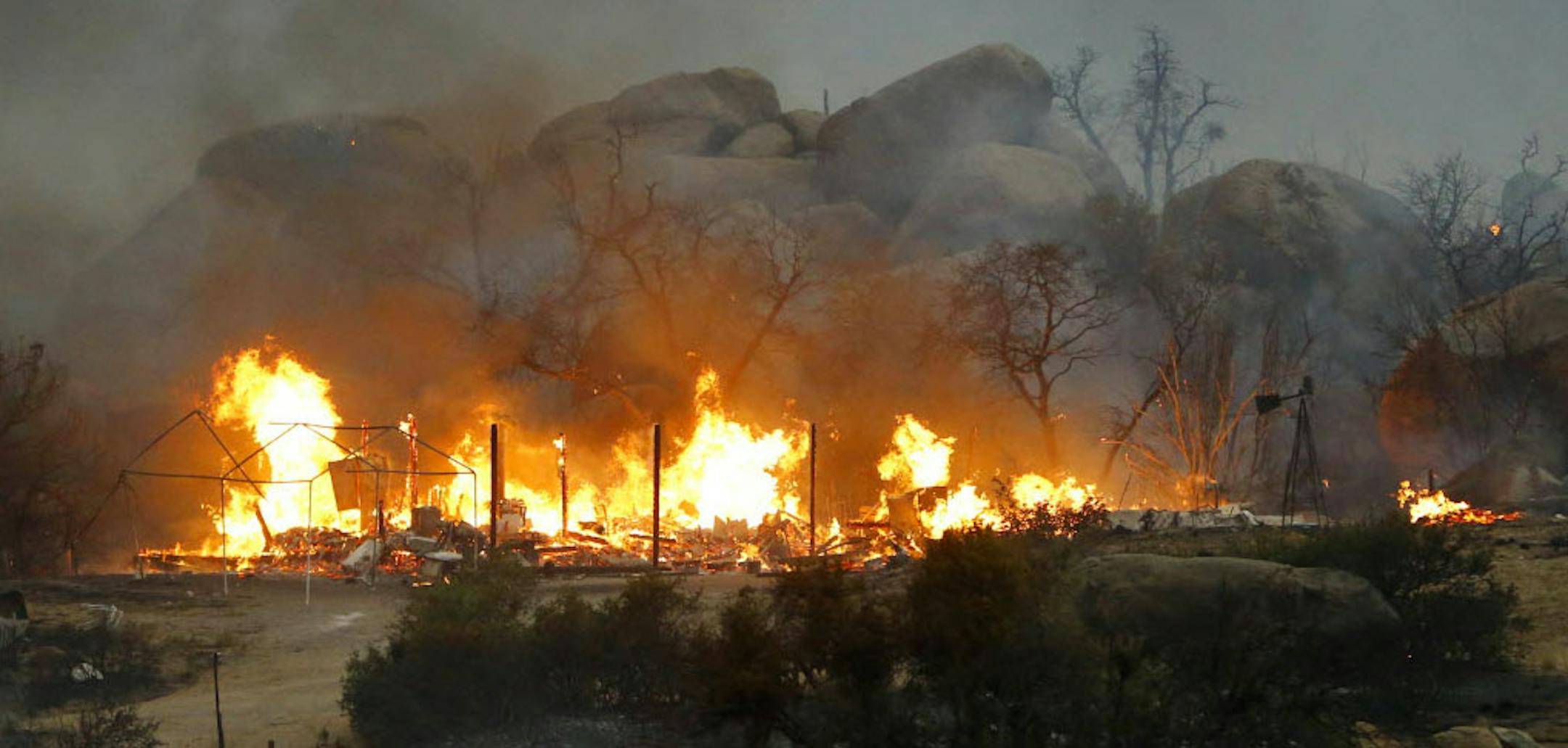 Homes burn as the Yarnell Hill Fire burns in Glenn Ilah on Sunday.