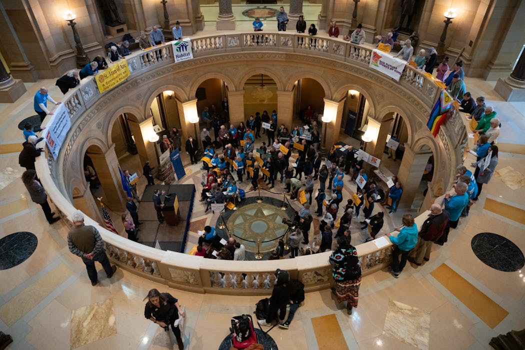 Affordable-housing advocates gathered in the rotunda inside the State Capitol in St. Paul on Tuesday.