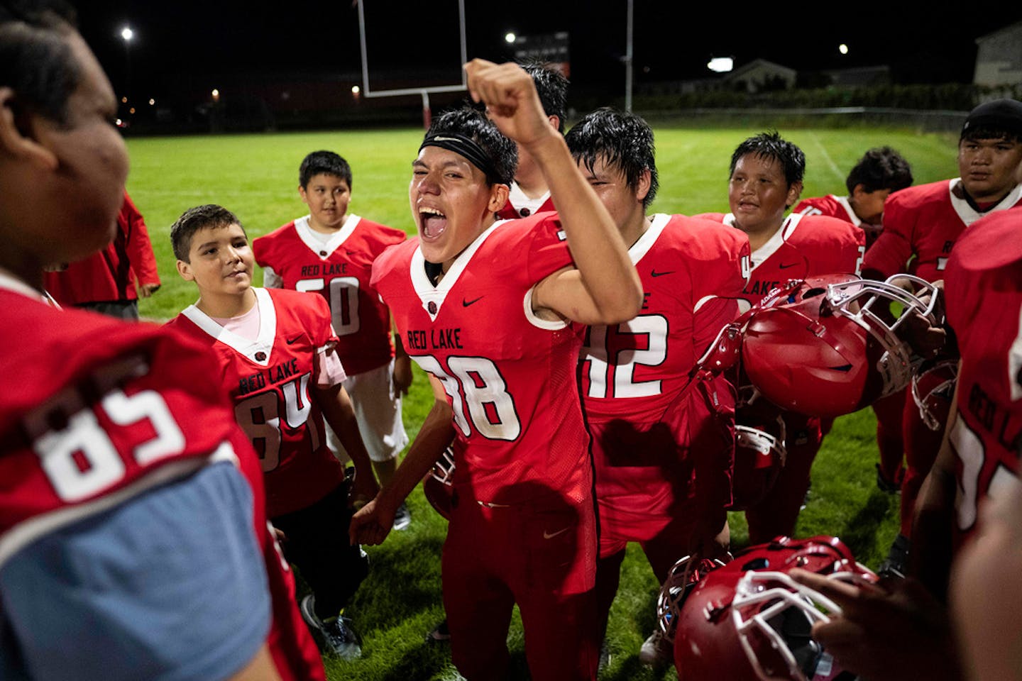 Red Lake senior Joshua "Noodle" Stillday leads his team in a jubilant post-game chant after being defeated by New York-Mills 70-6.