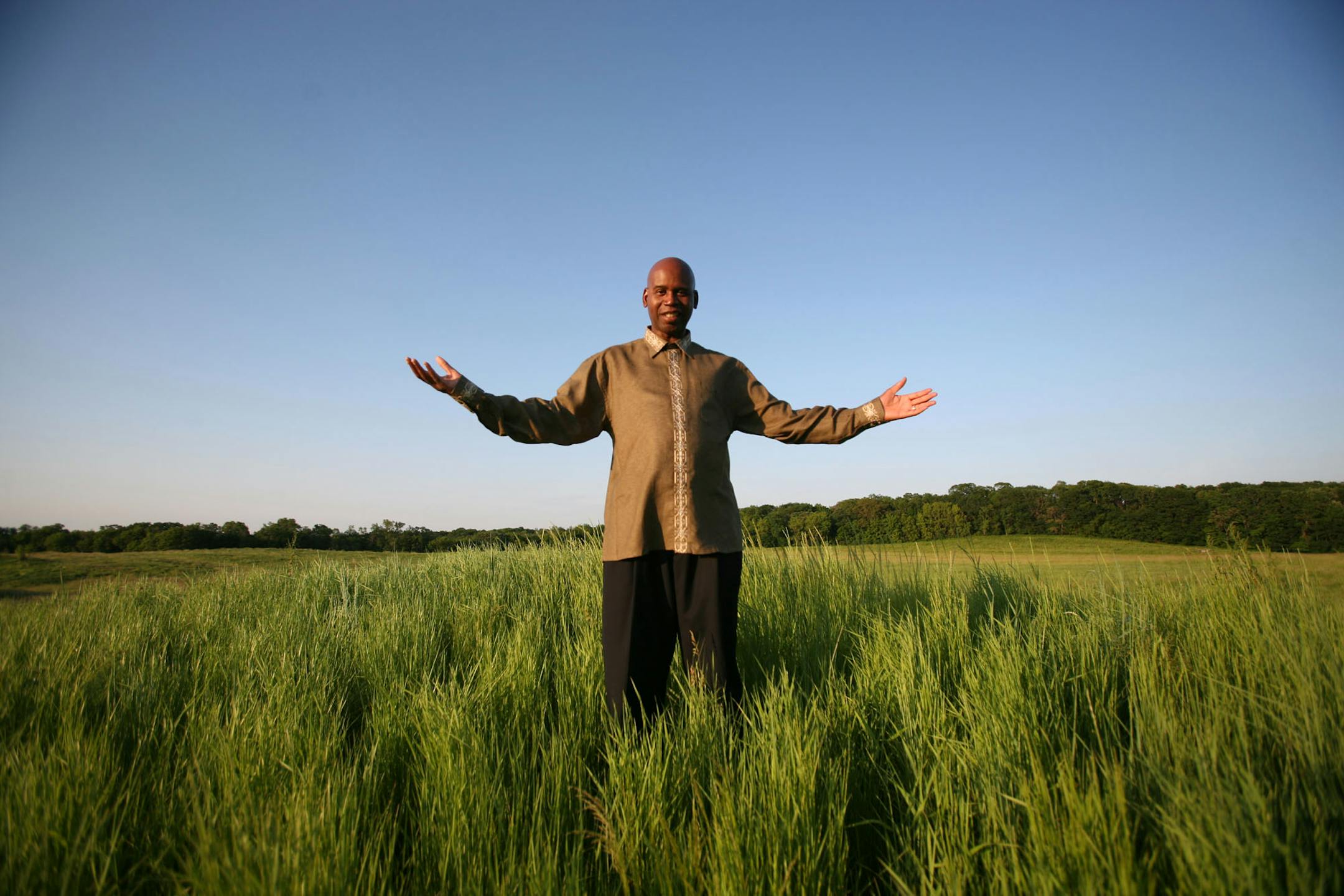 Pastor Randy Morrison of Speak the Word Church feels God's presence when he walks a piece of land in Plymouth where a new church will be built.