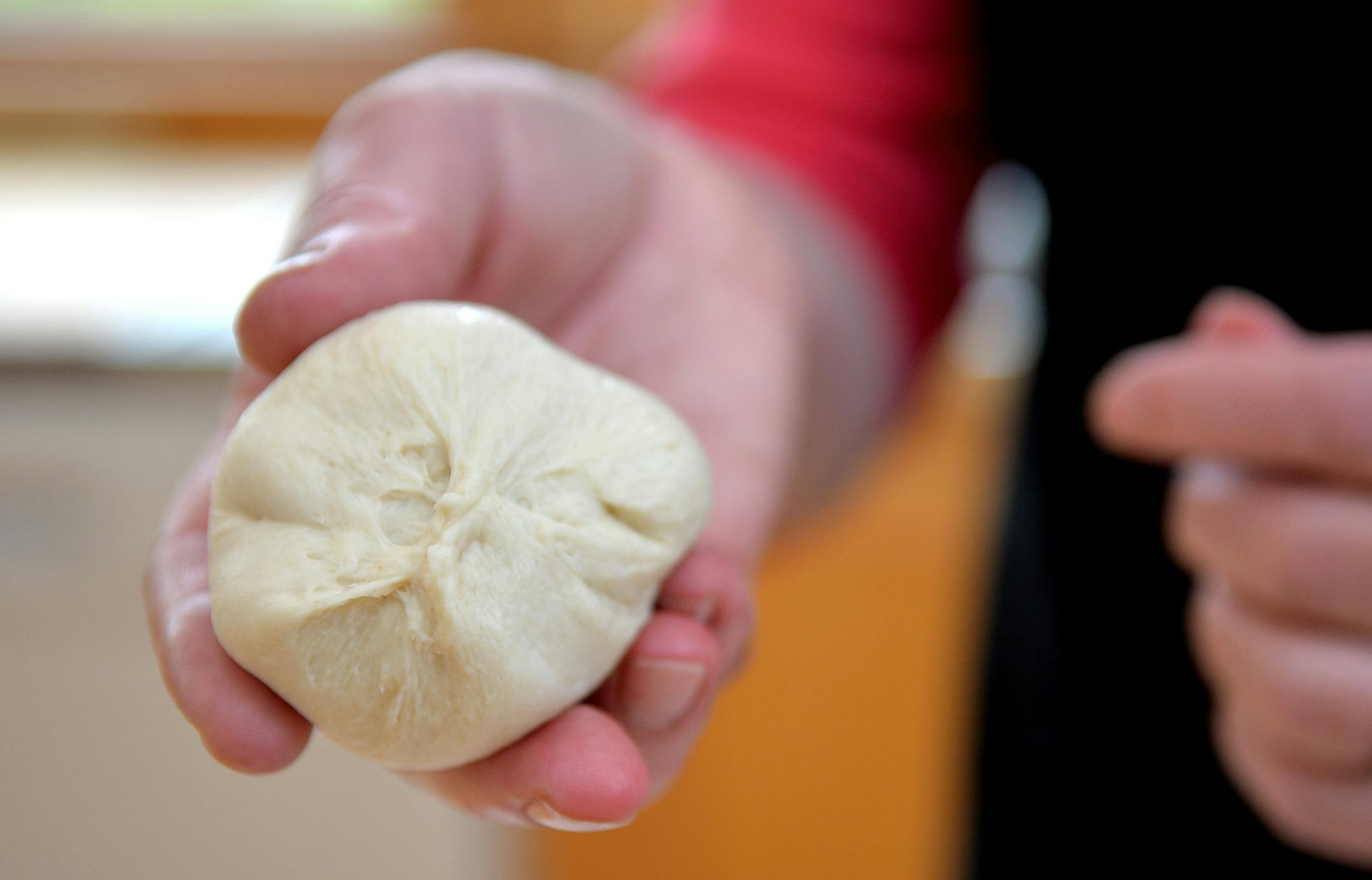 Pinch the dough closed on the bottom. ] (SPECIAL TO THE STAR TRIBUNE/BRE McGEE)