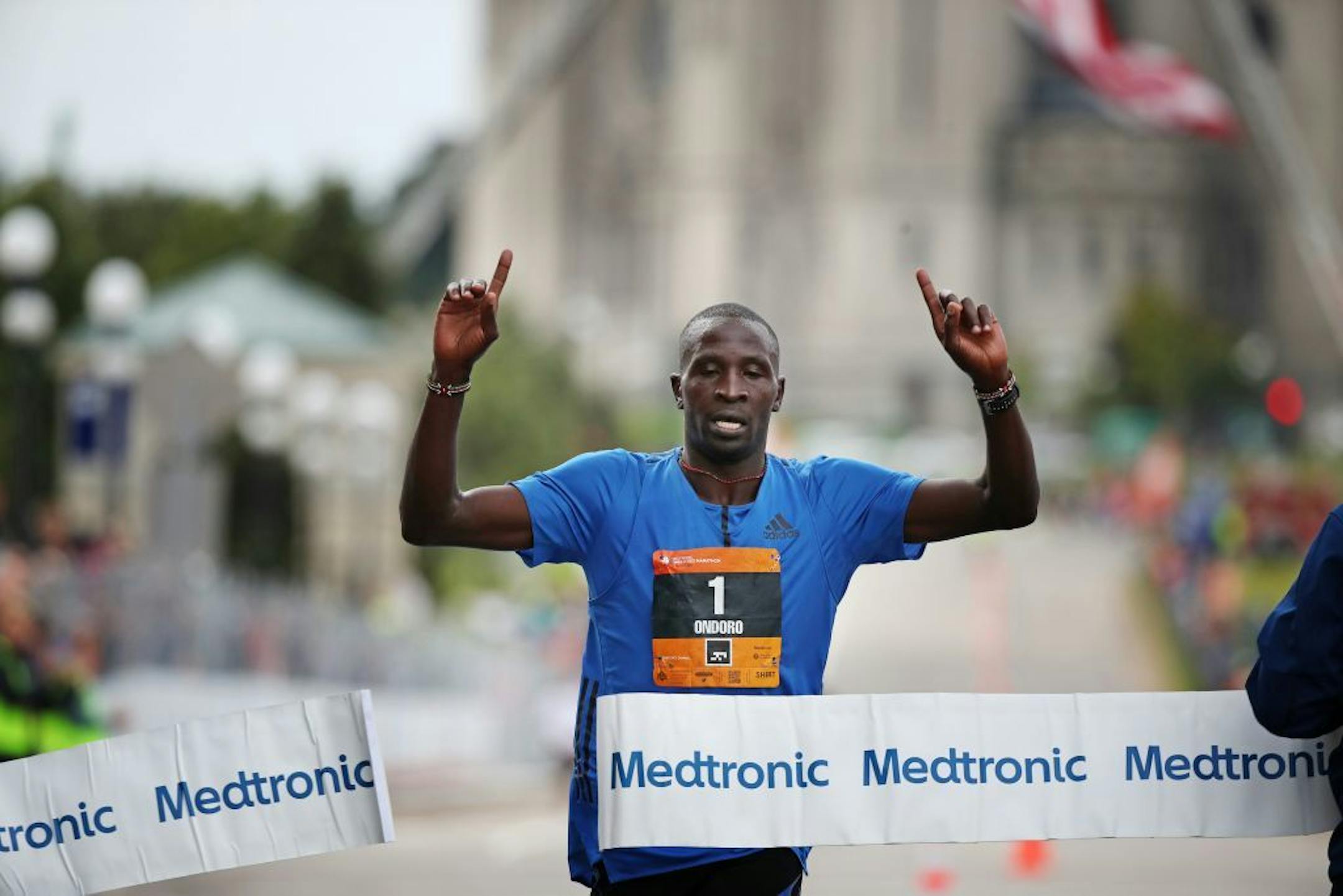 Dominic Ondoro won the men's division as he crossed the finish line at the Capitol of the Twins Cities Marathon Sunday October 1,2017 in St. Paul, MN.