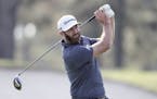 Dustin Johnson tees off on the third hole during the final round of the Masters golf tournament Sunday, Nov. 15, 2020, in Augusta, Ga.