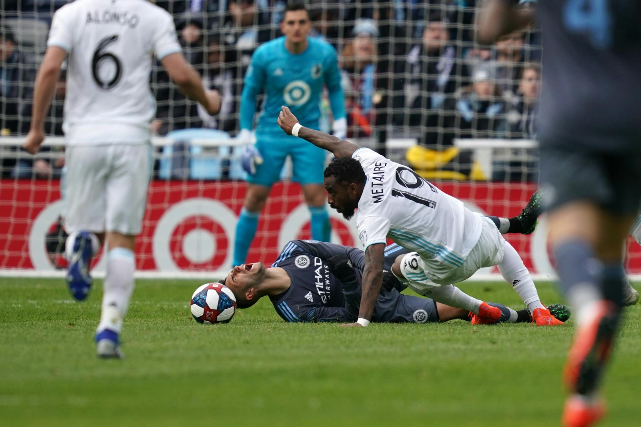 New York City midfielder Valentin Castellanos (11) went down as he collided with Minnesota United defender Romain Metanire (19) in the second half.