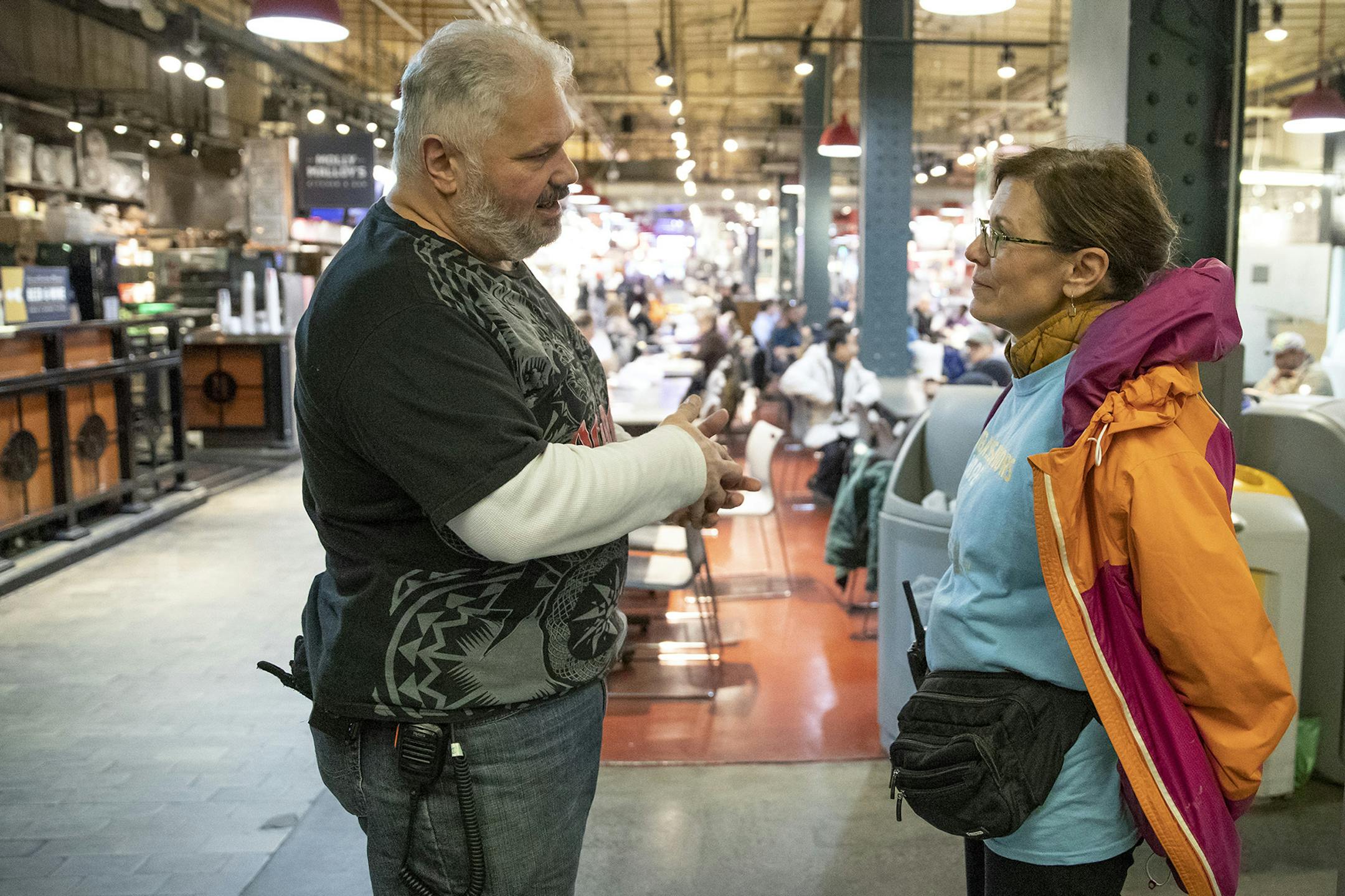 Teresa Giuliana, an ambassador of hope with Project Home, speaks with security guard Frank Nardo at Reading Terminal Market on Friday, Nov. 22, 2019. (Heather Khalifa/The Philadelphia Inquirer/TNS) ORG XMIT: 1499246 ORG XMIT: MIN1911260336310774