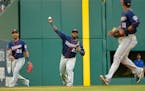 Minnesota Twins third baseman Miguel Sano (22) catches a Texas Rangers third baseman Joey Gallo (13) fly ball during the second inning at Globe Life P
