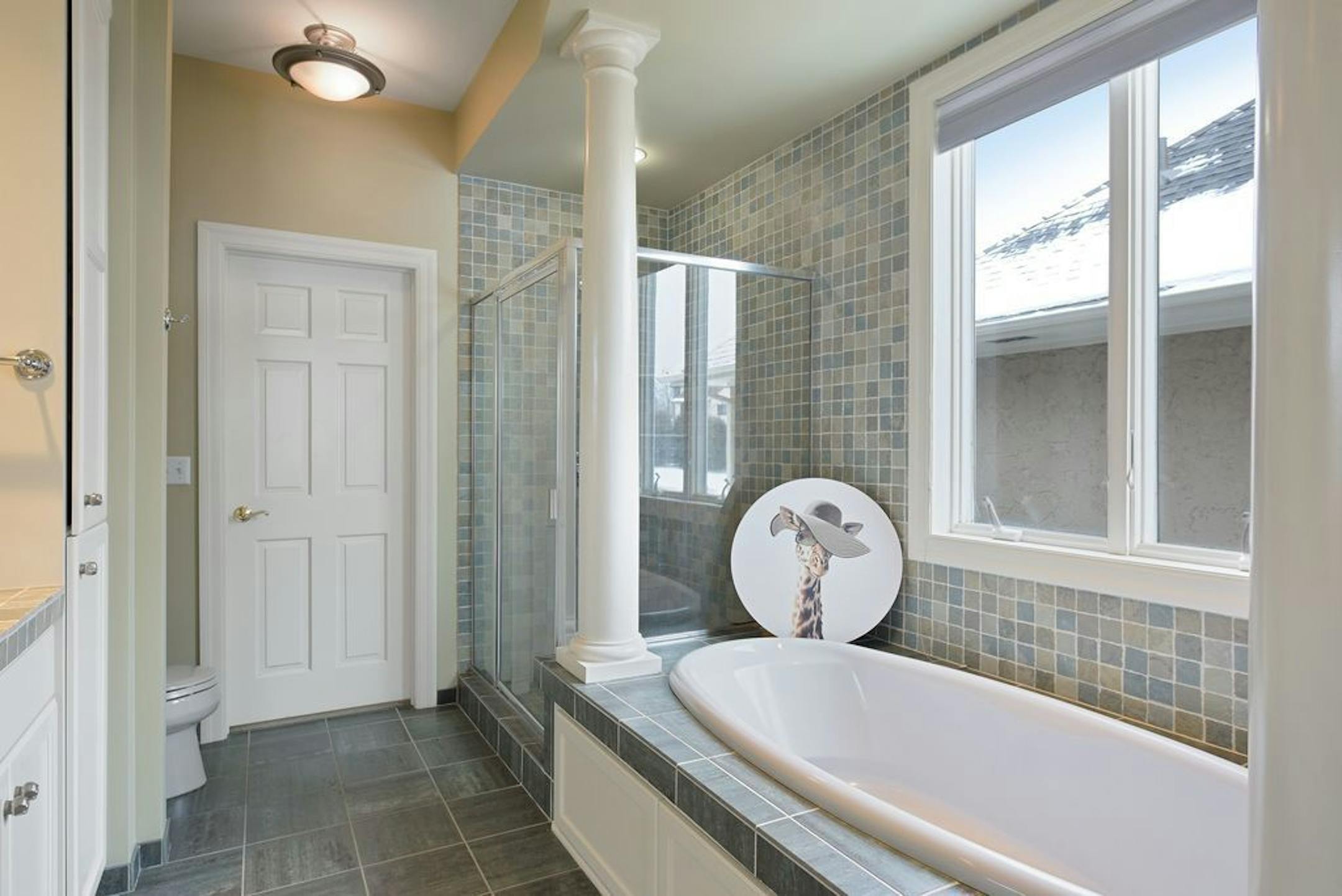 A bathroom with soaking tub.