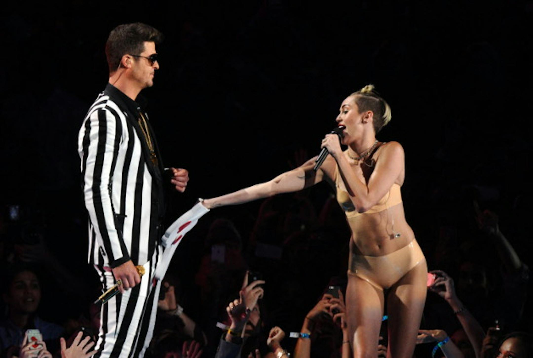 Robin Thicke and Miley Cyrus performed together in the "Twerk Heard 'Round the World" appearance at the MTV Video Music Awards in September. / Charles Sykes, Invision, AP