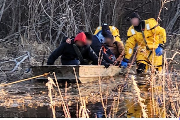 Federal agents and local emergency agencies rescued a group of nine west of Warroad. The faces in this image were obscured by the U.S. Customs and Bor