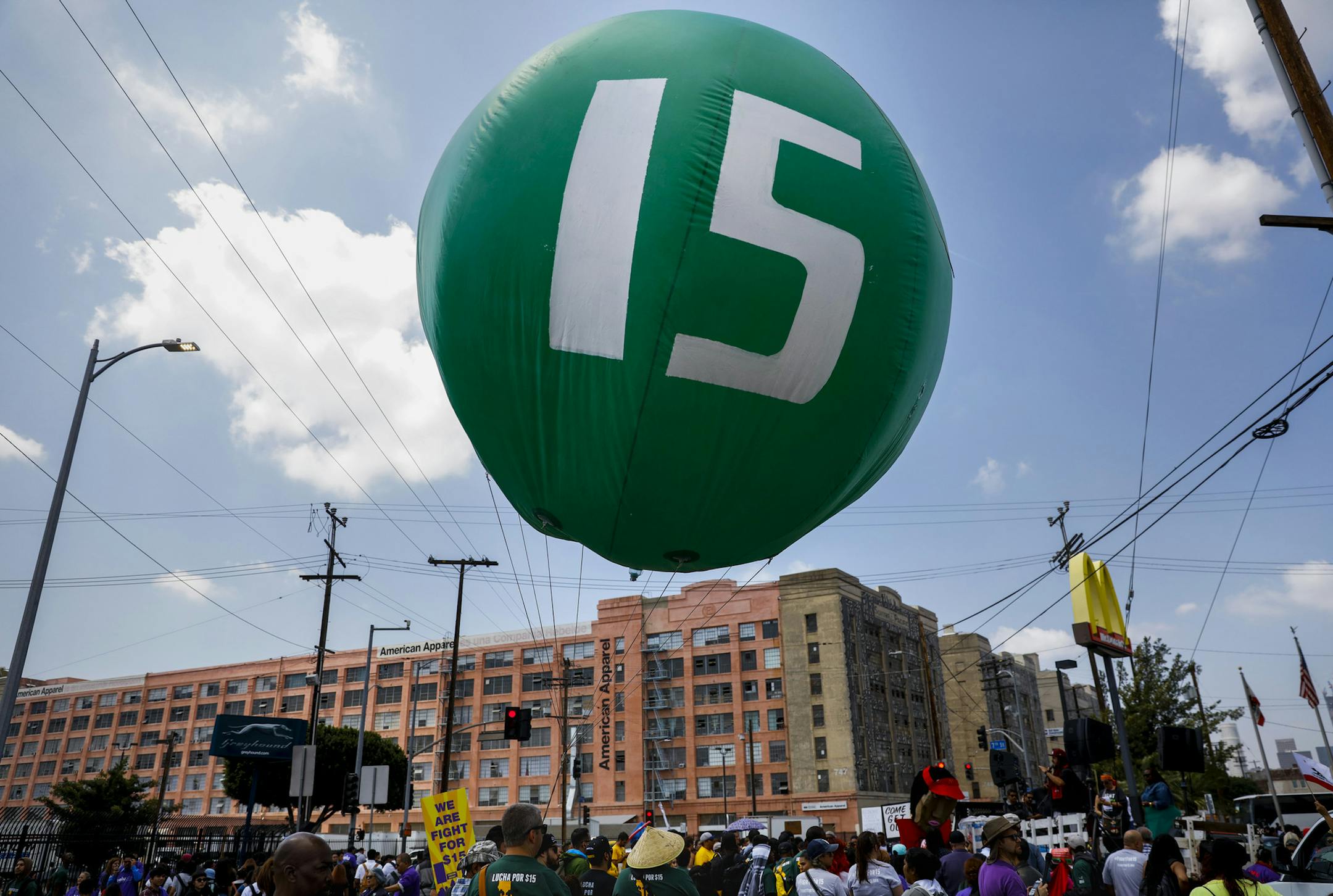 Workers march through downtown Los Angeles on April 14 to demand a nationwide $15-an-hour minimum wage. (Jay L. Clendenin/Los Angeles Times/TNS) ORG XMIT: 1184132