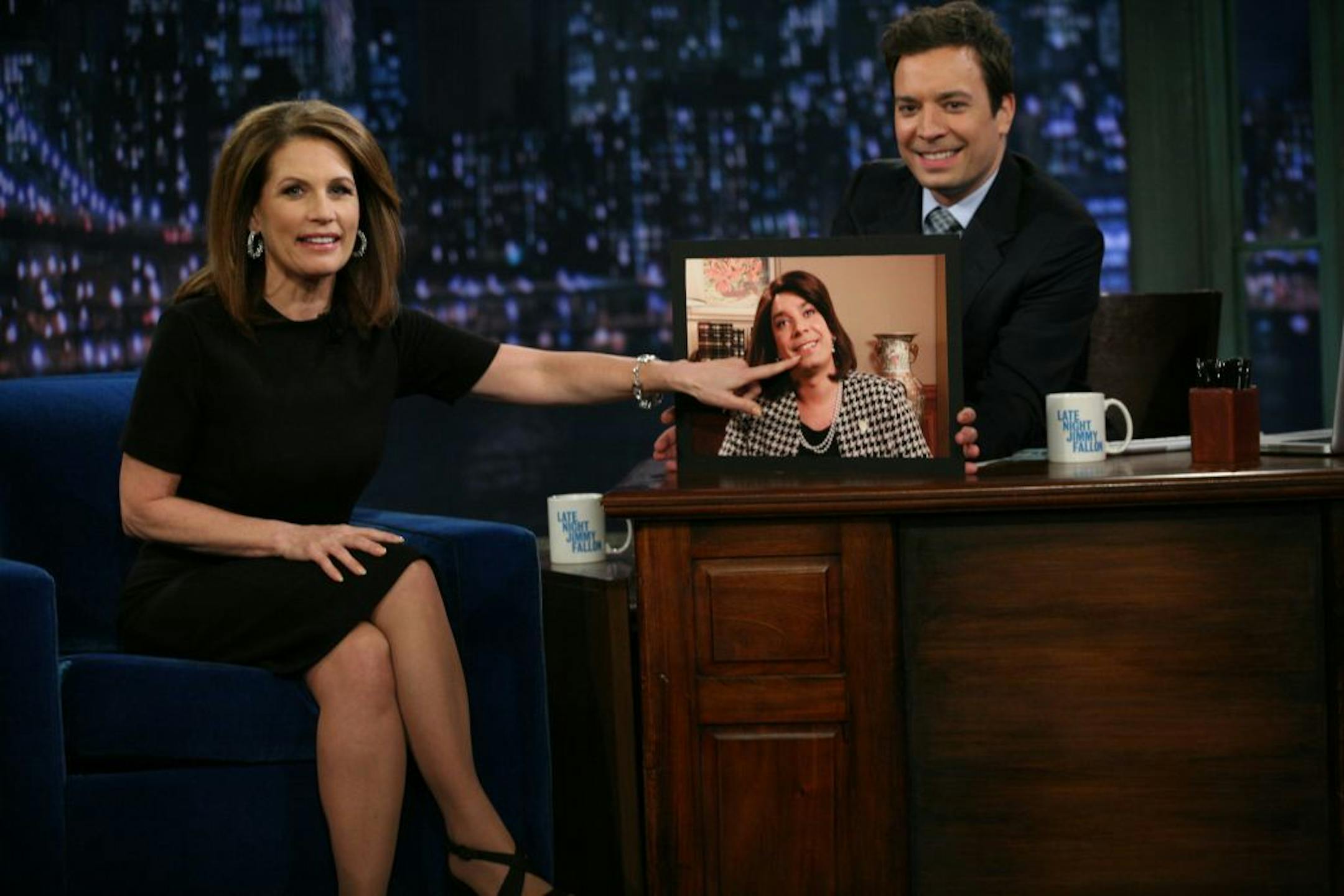 In this image released by NBC, GOP presidential candidate Michele Bachmann pointed to a photo of "Late Night With Jimmy Fallon" host Jimmy Fallon, dressed as Bachmann.