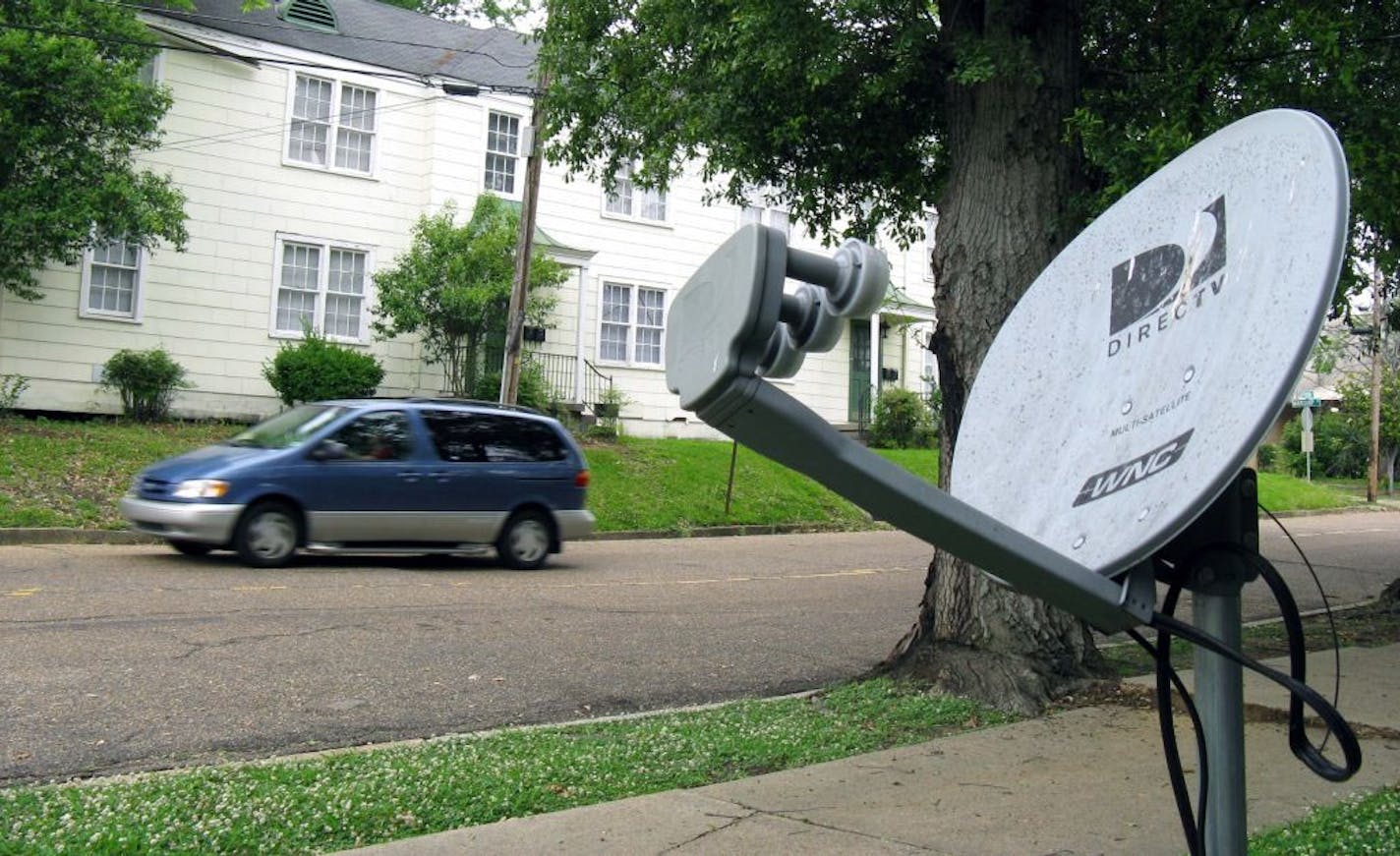 A DirecTV satellite dish in Jackson, Miss. Tribune Broadcasting says there's been no settlement with DirecTV Inc. in their contract negotiations, which means DirecTV subscribers in 19 U.S. markets will lose access to certain programming, Saturday, March 31, 2012.