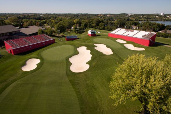 The greens of holes 18, left, and 9, of the Ryder Cup at Hazeltine National Golf Club.