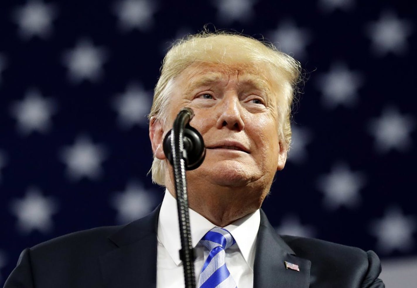 President Donald Trump paused while speaking during a rally Tuesday night in Charleston, W.Va.