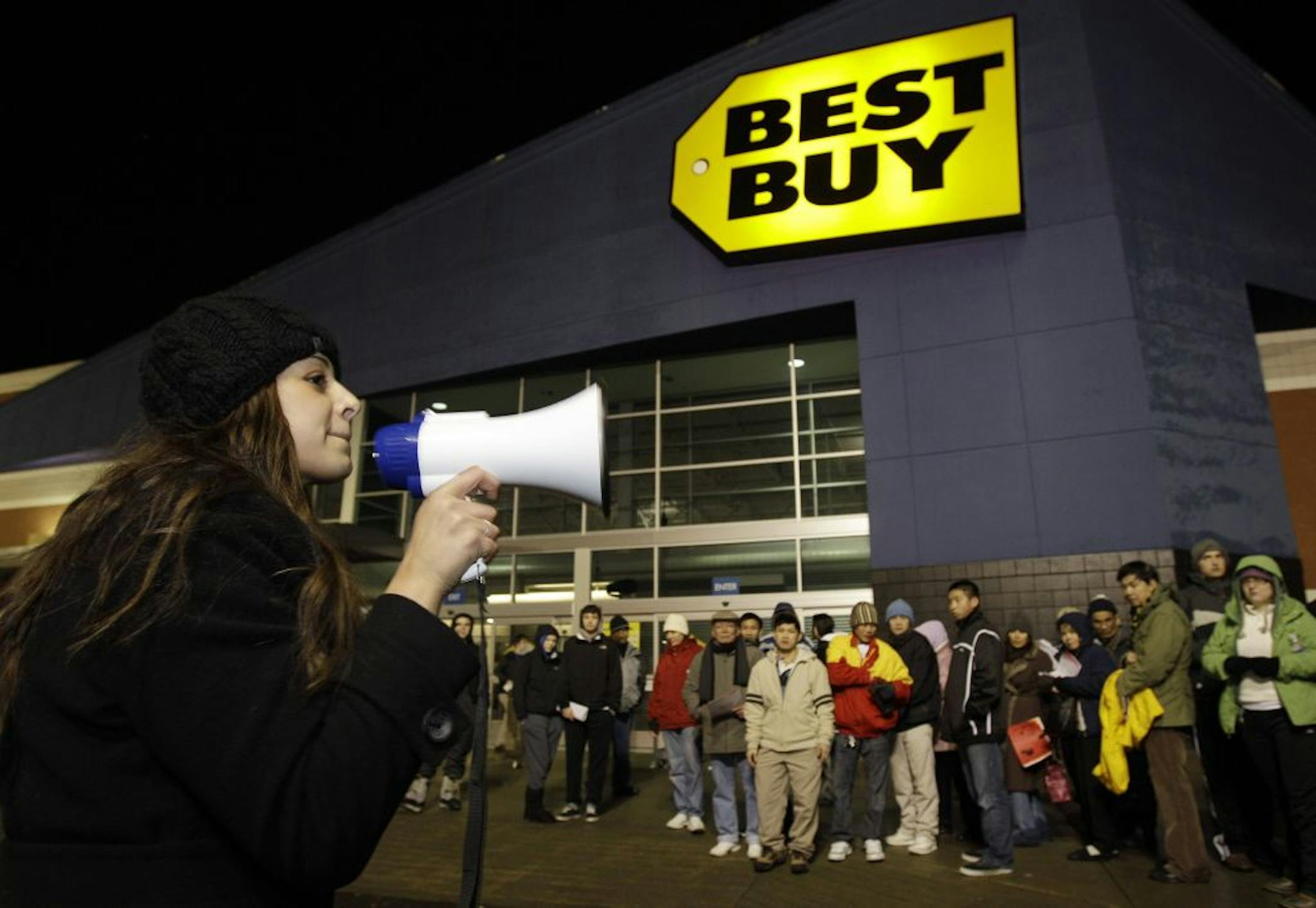 Lucia Valenuela used a bullhorn to corral crowds of "Black Friday" shoppers last year in Tacoma, Wash.