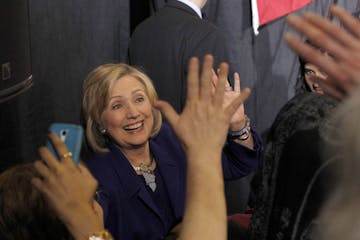 Former Secretary of State Hillary Rodham Clinton greets the crowd at a get-out-the-vote rally in support for Democratic U.S. Sen. Al Franken and Minne