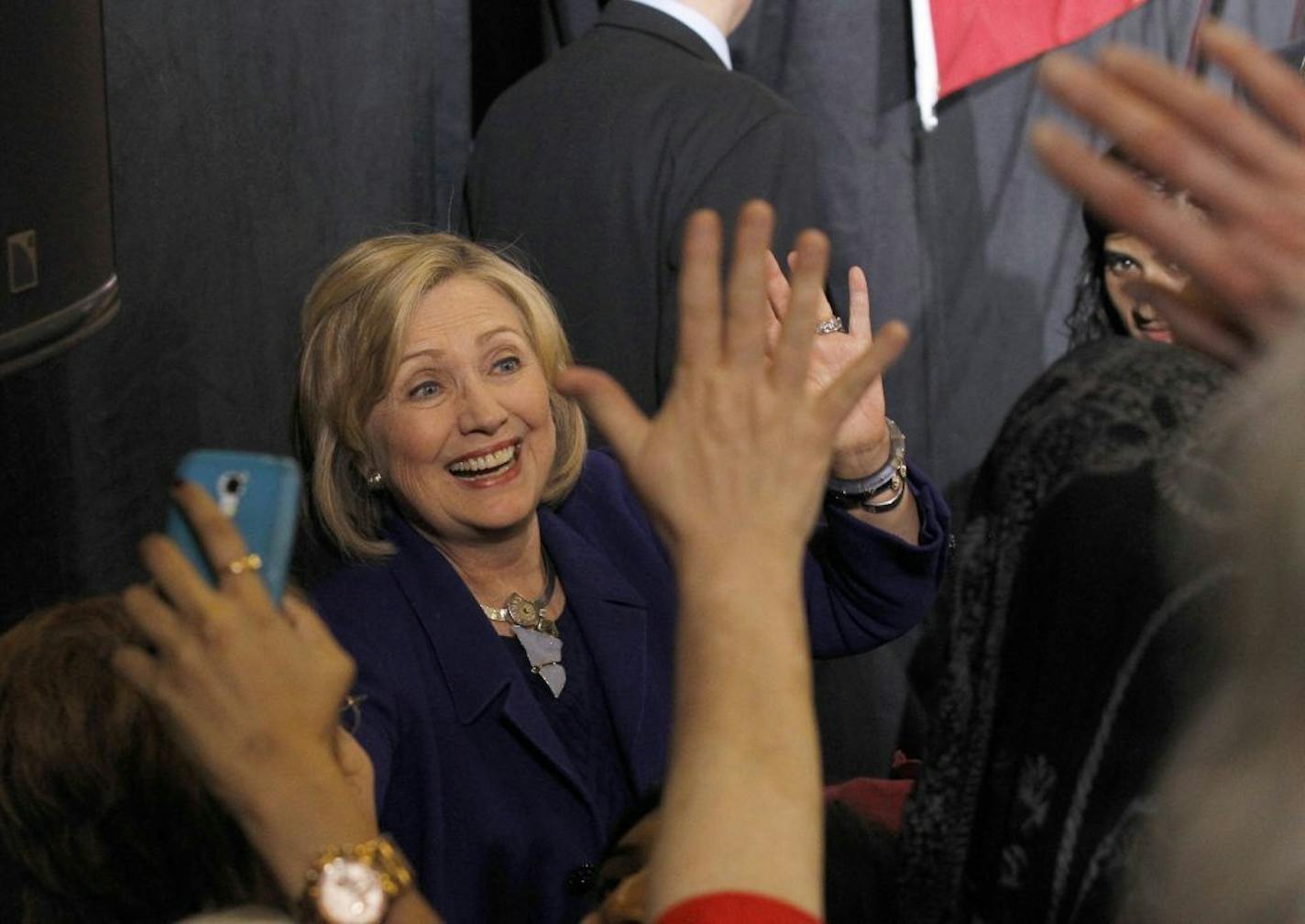 Former Secretary of State Hillary Rodham Clinton greets the crowd at a get-out-the-vote rally in support for Democratic U.S. Sen. Al Franken and Minnesota Democratic Gov. Mark Dayton at Macalester College in St. Paul, Minn., Thursday, Oct. 23, 2014.