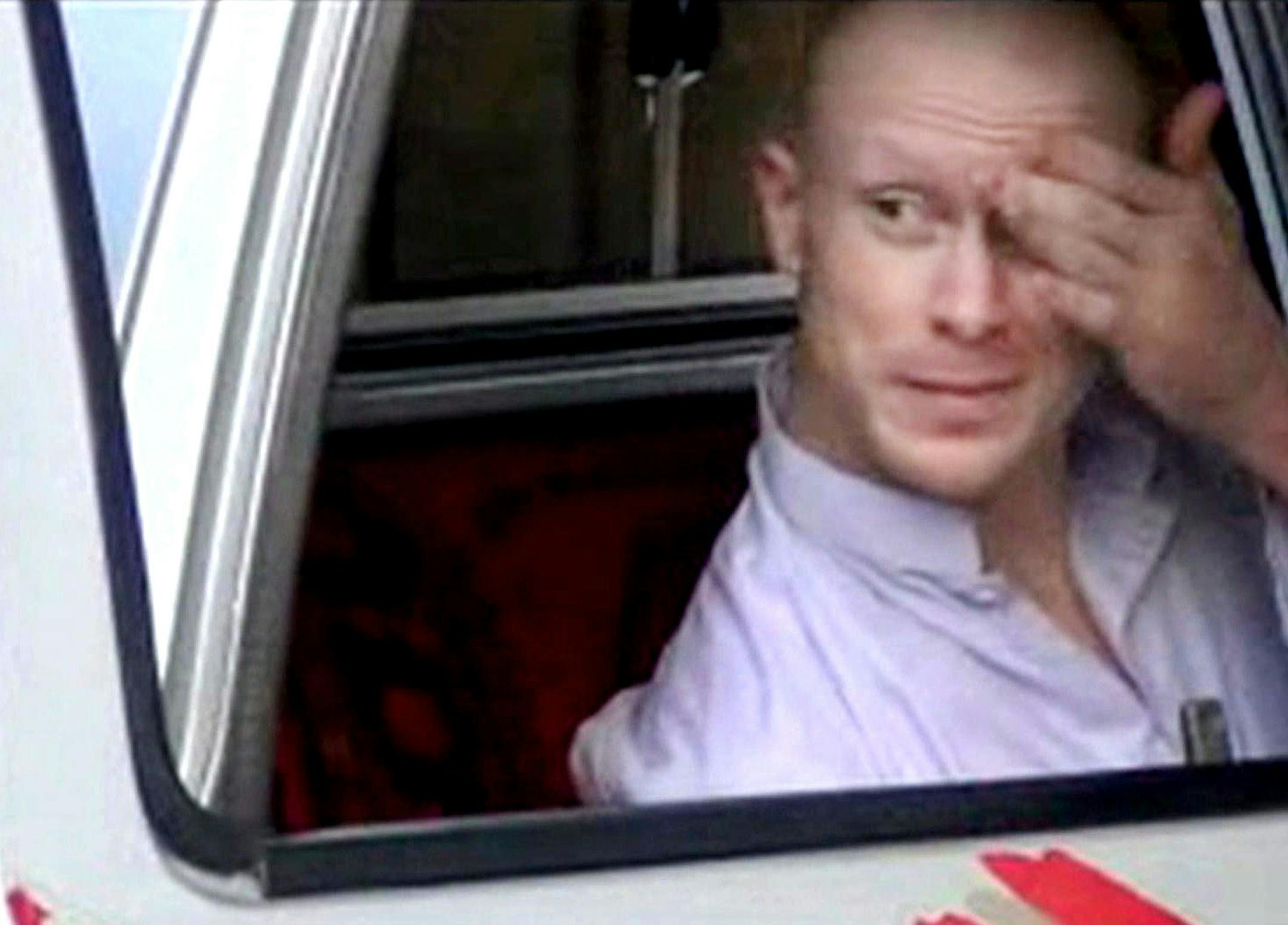 Sgt. Bowe Bergdahl sits in a vehicle guarded by the Taliban in eastern Afghanistan.