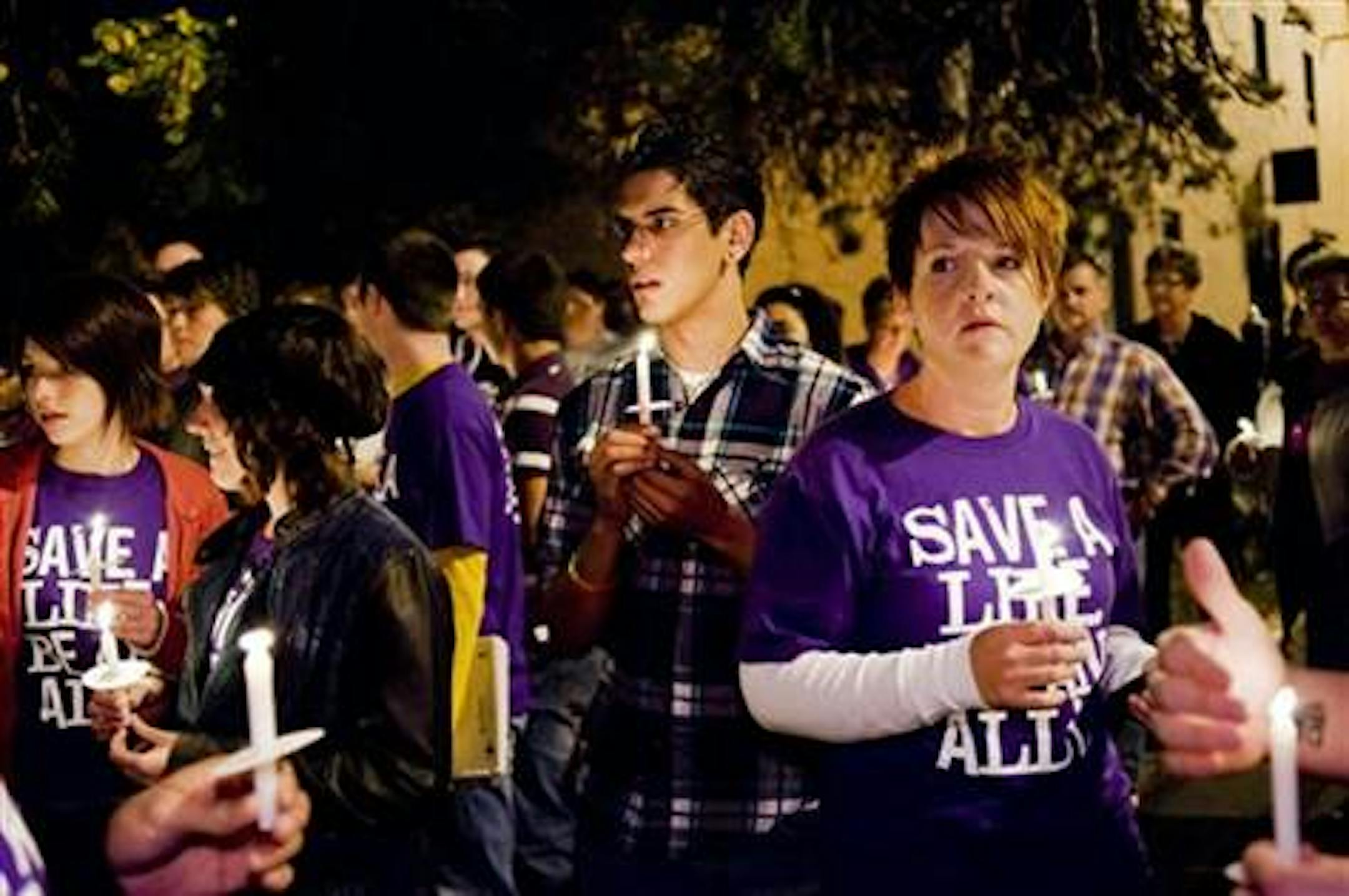 Photo is from a 2010 candlelight procession held in Columbia, Mo., in response to the suicide deaths of several gay teens who were bullied.