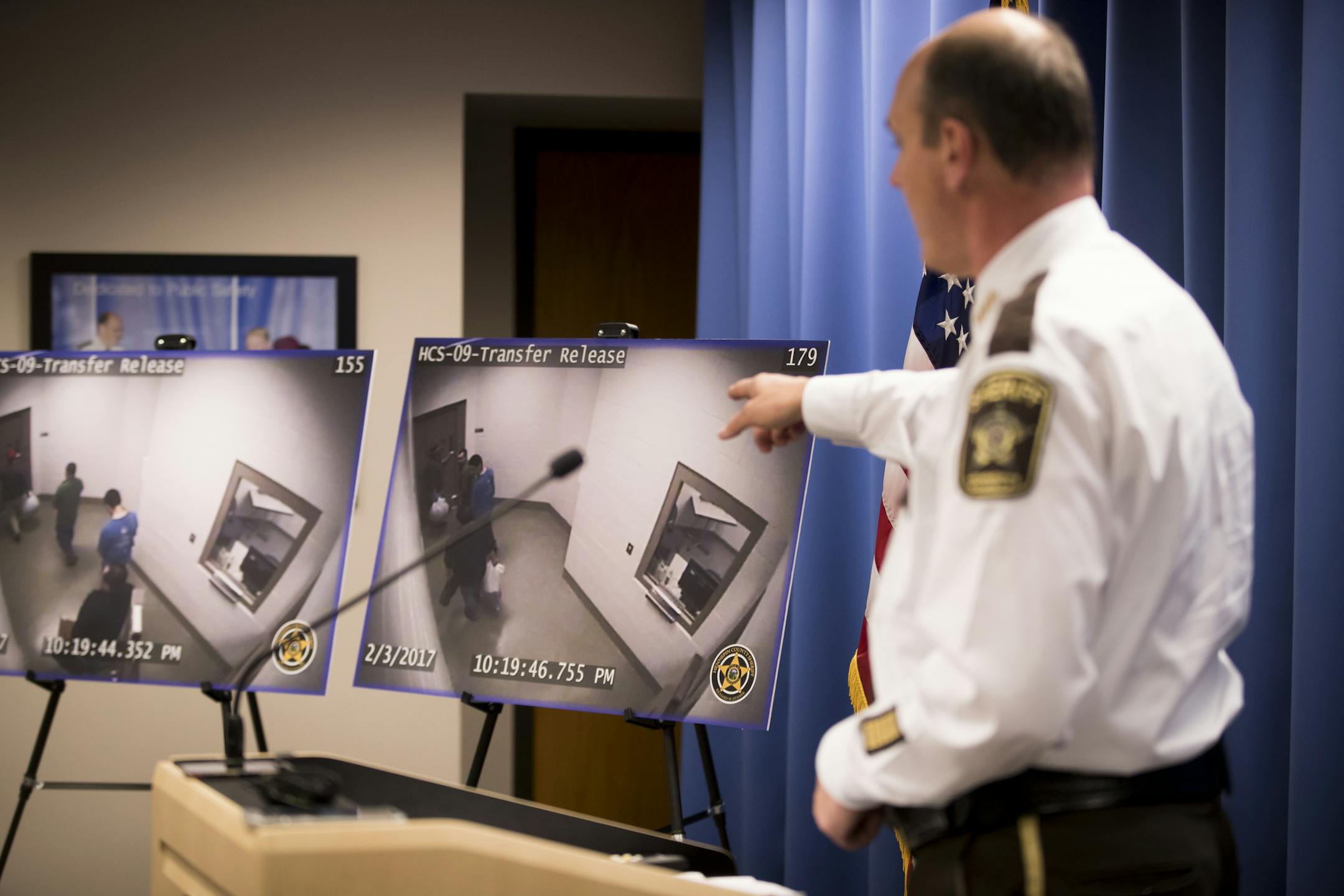 Sheriff Rich Stanek points to surveillance footage of ICE detaining two individuals as they were released from jail in defense of Hennepin County after it was listed in an ICE non-compliance weekly list.