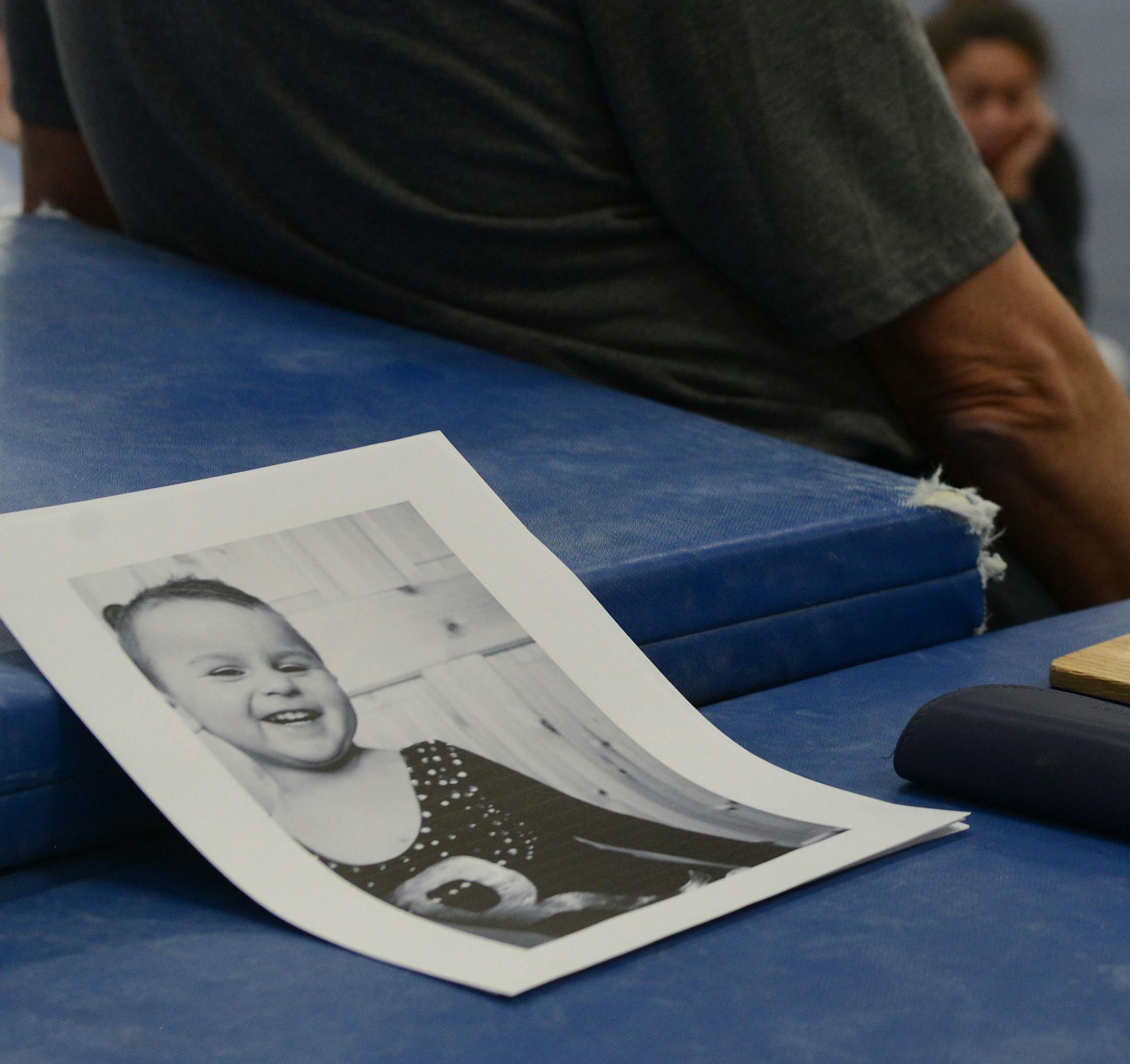 A picture of Taylor Grace Nguyen lays on a mat during the Roseville's girls gymnastics practice. ] BRIDGET BENNETT • Special to the Star Tribune bridget.bennett@startribune.com Girls gymnastics team practice at Roseville Area High School, Monday, Feb. 16, 2015 Taylor Grace Nguyen was "adopted" by the team. She passed away on Wed., Feb. 11, three days before the Section 4AA meet. The high school is called Roseville Area High School… I called them Roseville gymnasts. Not sure if I sh