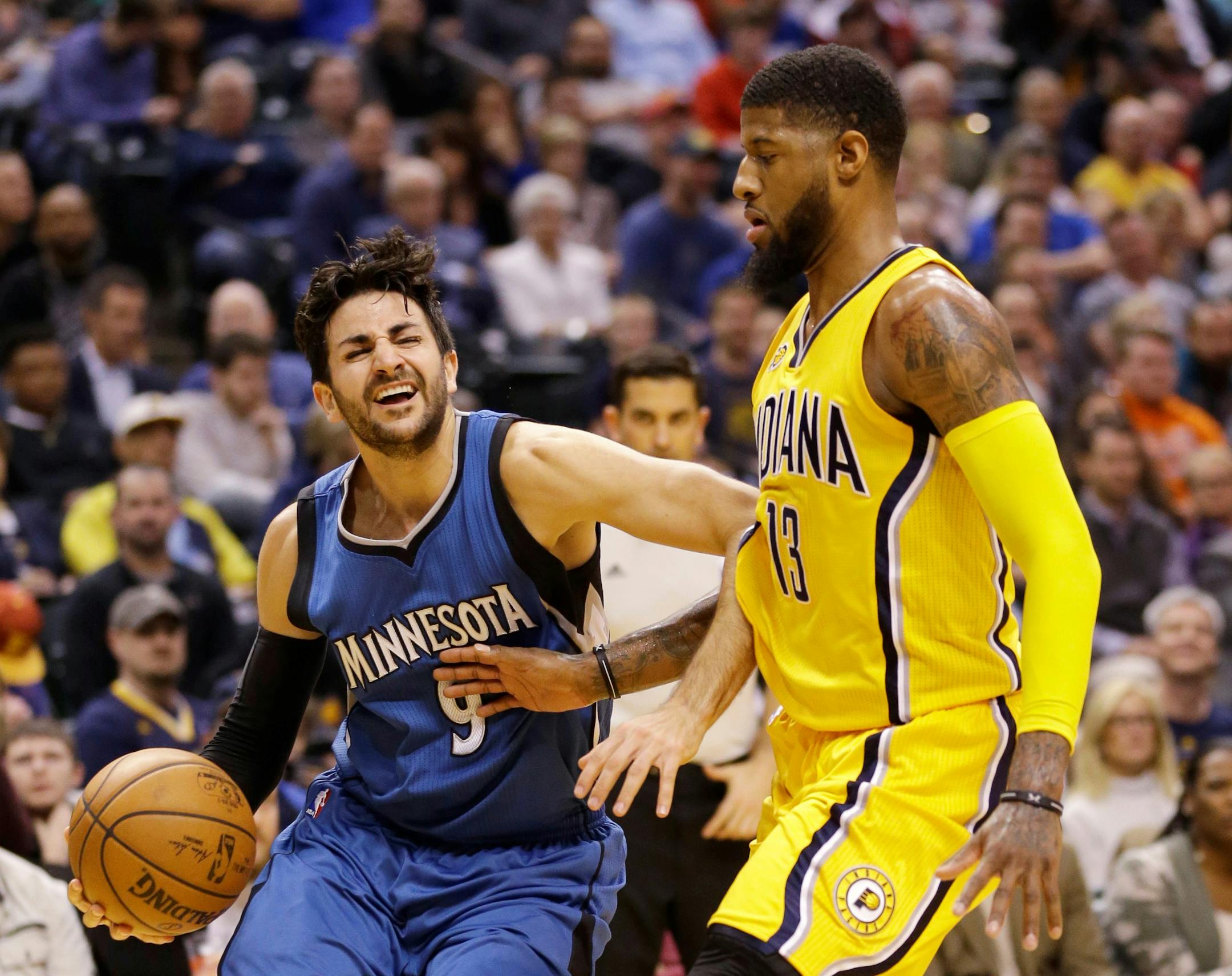 Timberwolves guard Ricky Rubio, right, drove against Indiana forward Paul George during the first half of Tuesday's game in Indianapolis. Rubio hit three free throws with 3.4 seconds left to give the Wolves a 115-114 victory.