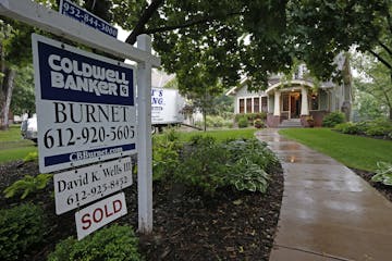 A for sale sign outside an Edina home in July 2014.