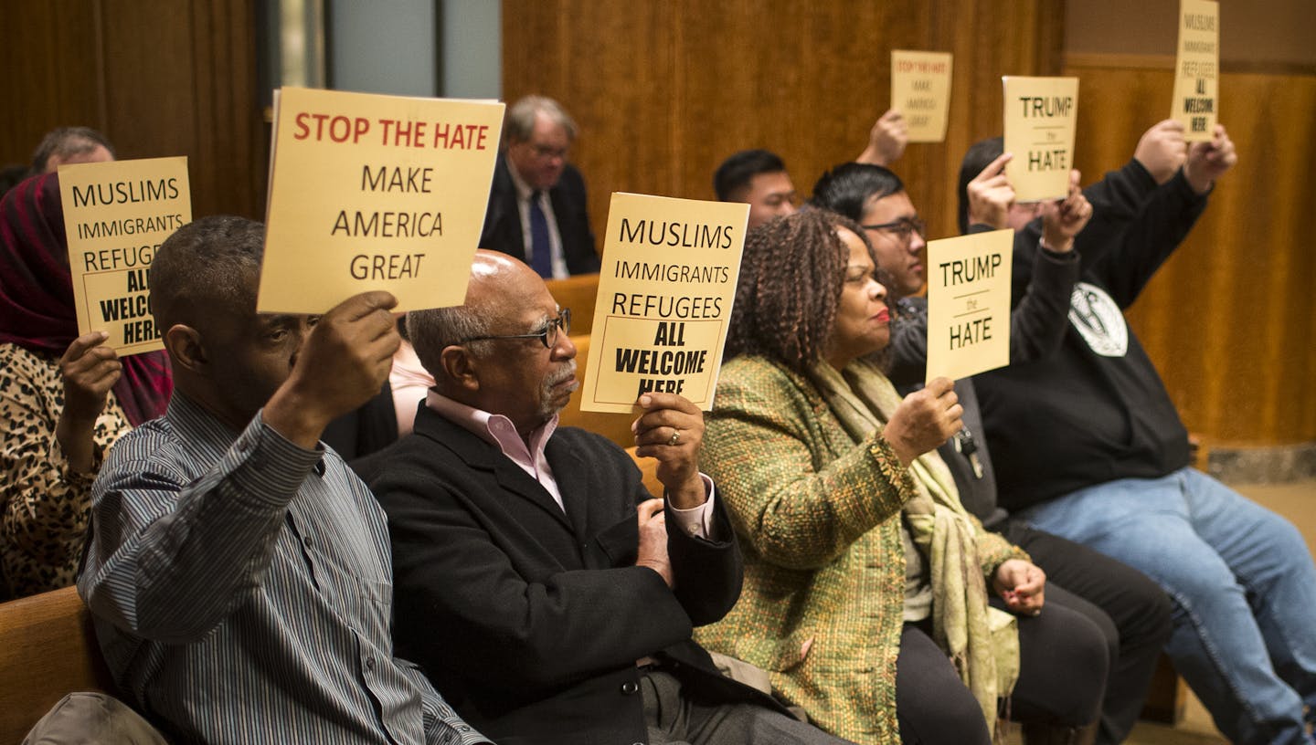 Demonstrators held signs voicing their support for a city council resolution condemning Republican presidential candidate Donald Trump for anti-Muslim, anti-refugee and anti-immigrant speech Wednesday night. ] (AARON LAVINSKY/STAR TRIBUNE) aaron.lavinsky@startribune.com The St. Paul City Council voted on a resolution condemning Republican presidential candidate Donald Trump for anti-Muslim, anti-refugee and anti-immigrant speech during a meeting Wednesday night in the St. Paul City Council Chamb